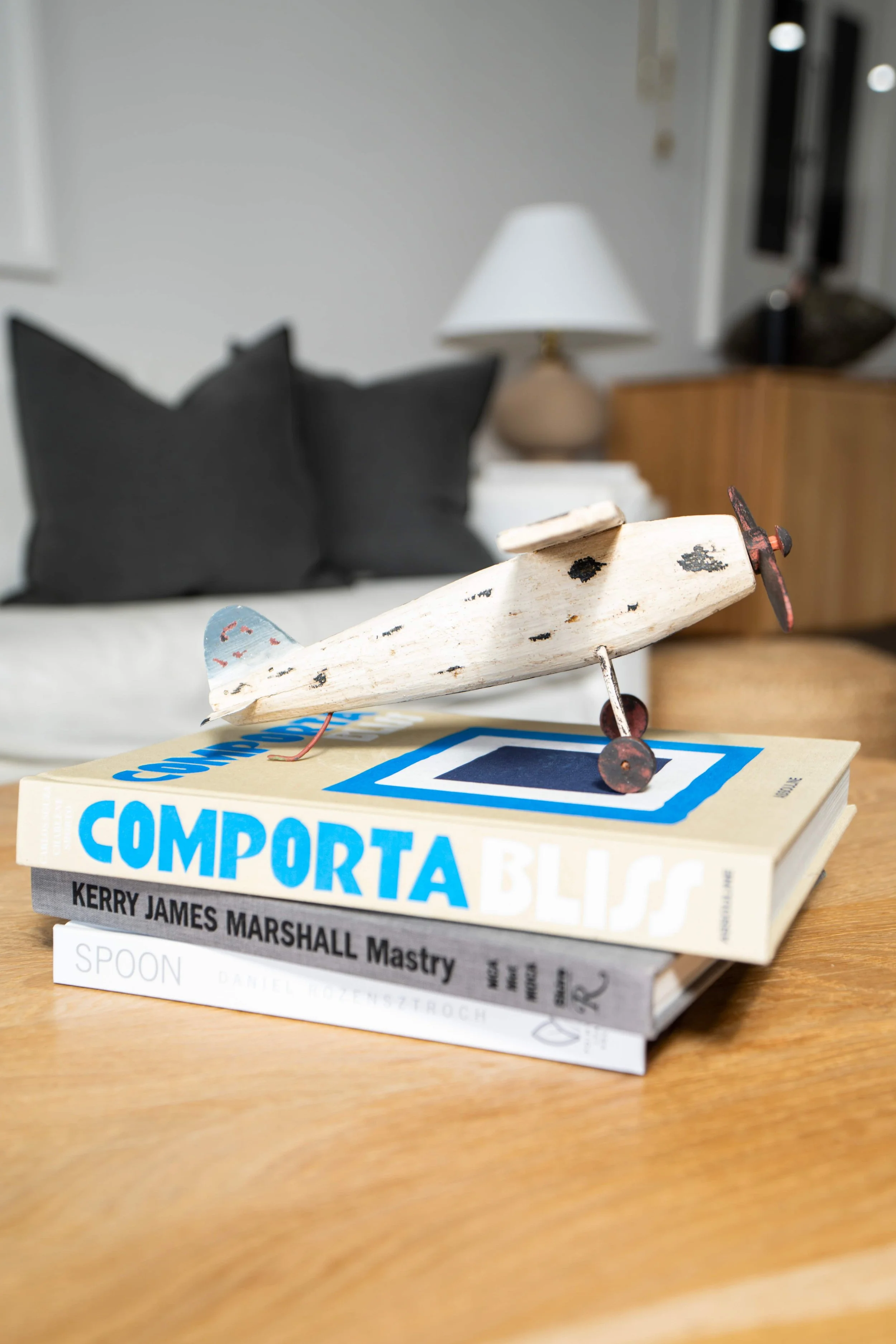 Antique Wooden Toy Airplane on Table.jpeg