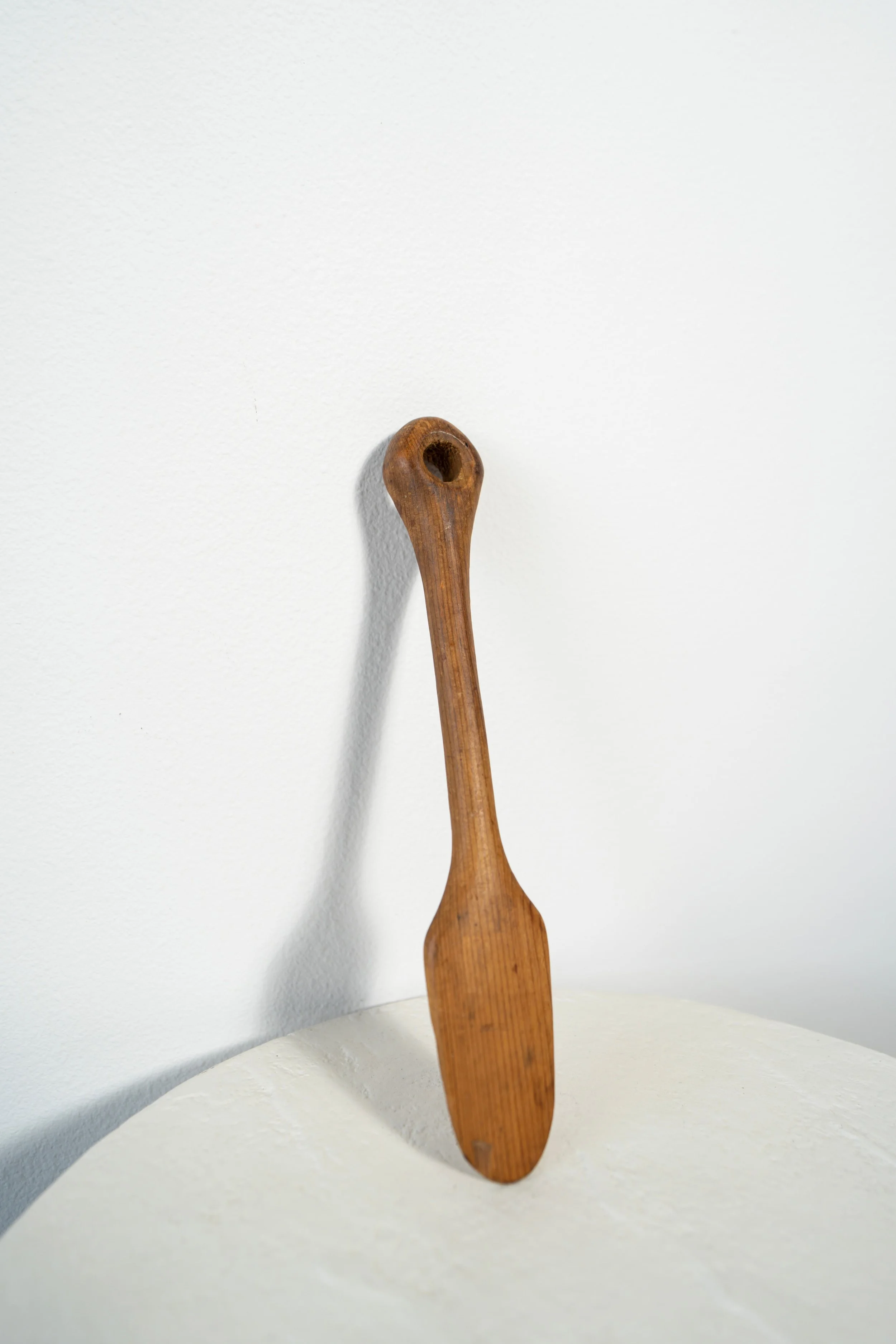 Antique Wooden Spoon,  Leaning on a table.jpeg
