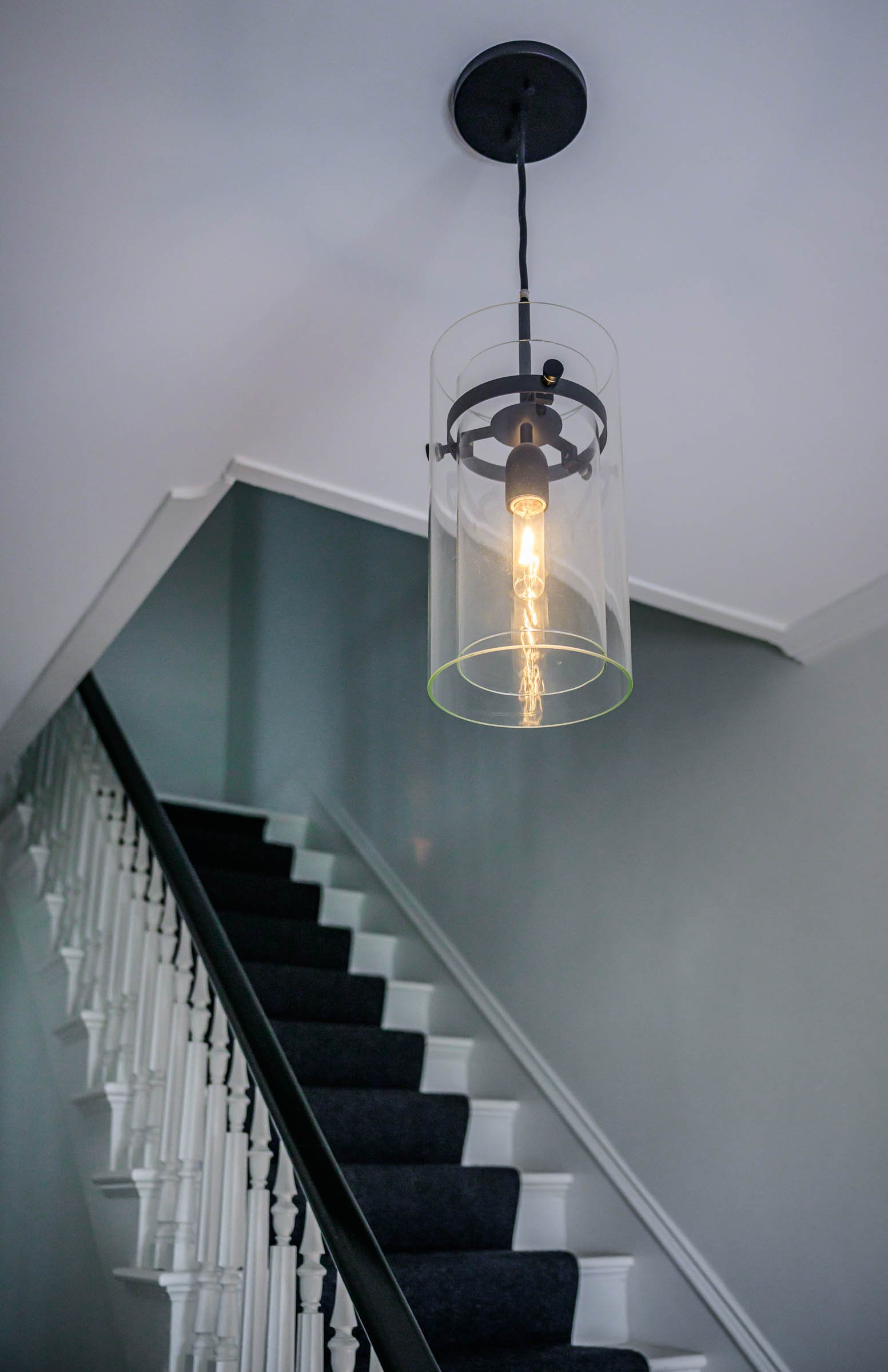 Historic staircase with Contemporary Light Fixture