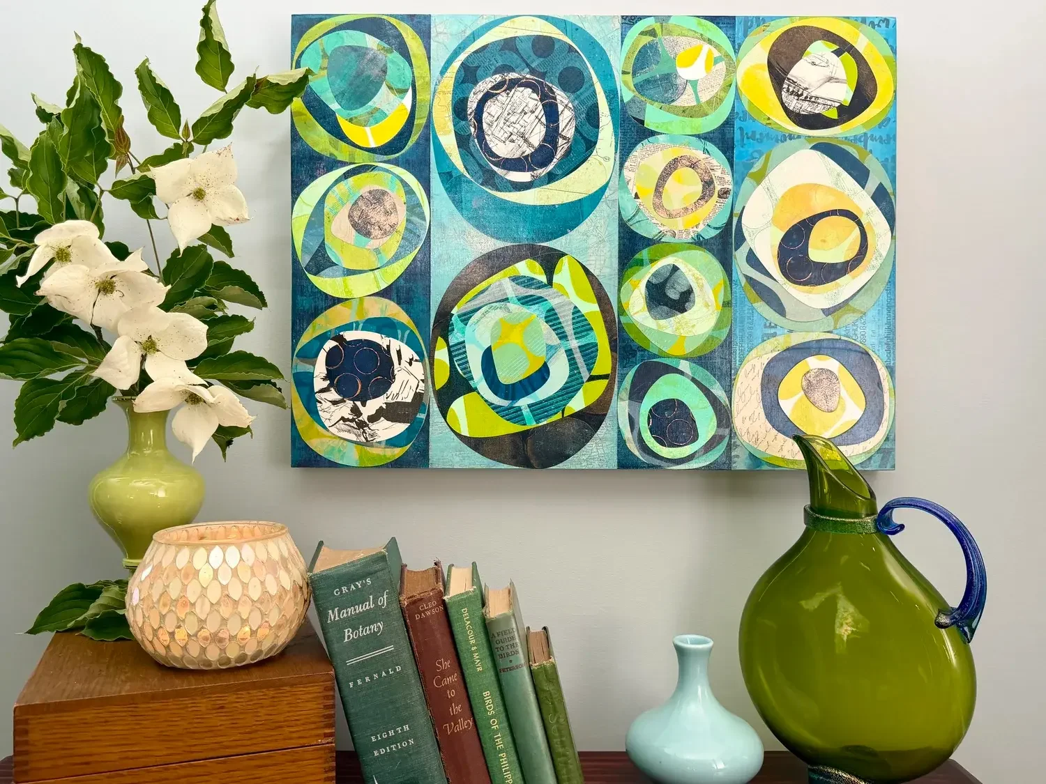 Mixed media artwork hanging on a wall