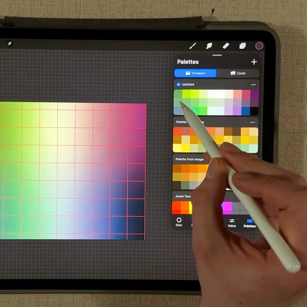 A hand uses a stylus on a tablet in Procreate, browsing a color palette grid and palette selection menu in a digital art app.