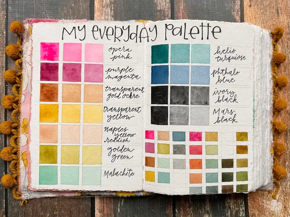 Open handmade journal titled My Everyday Palette with a palette of aesthetic watercolor colors