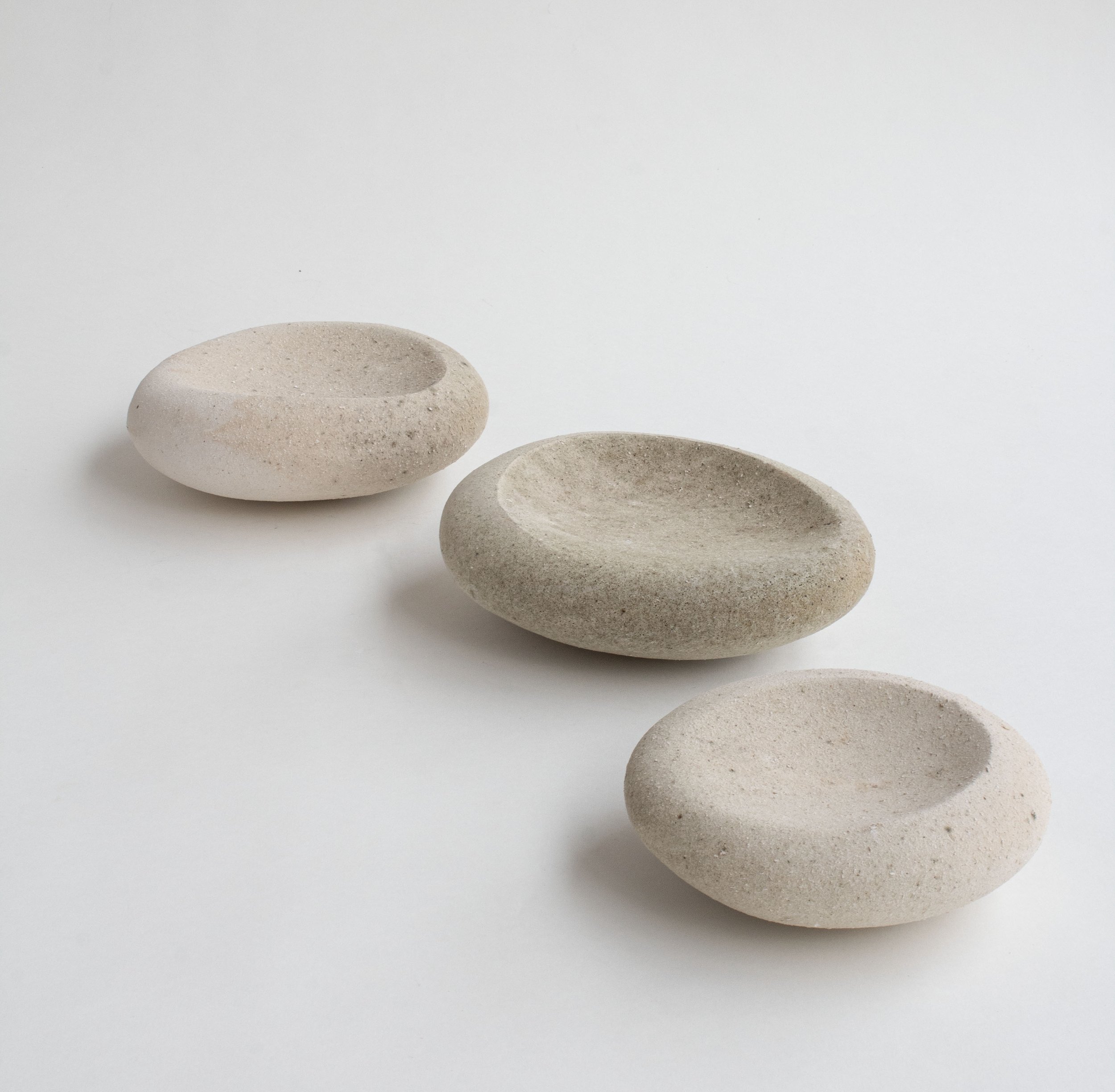 Impressed plates
Stoneware - wood ash slip, reduction cooled
3 x 6-8 - 6  approximately