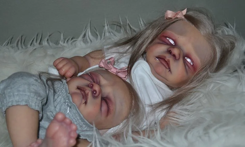 This scary little lady has a twin sister...conjoined at the belly! Both heads were rooted with our adult mohair in light ash blonde. The sculpt is by Tasha Edenholm.