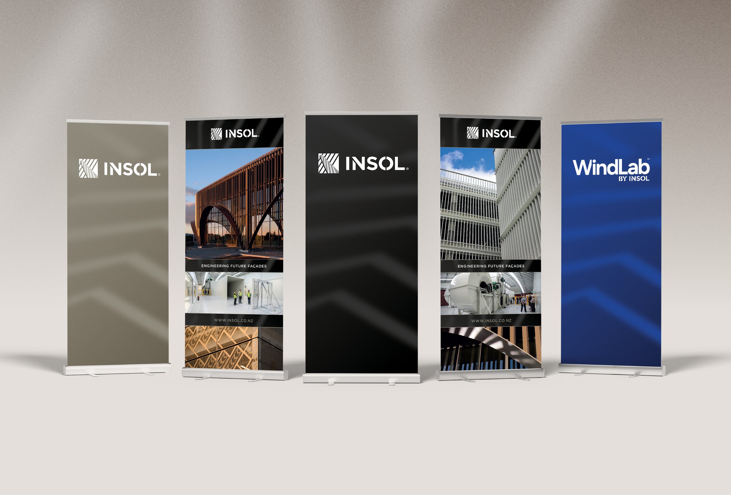 Five pull up banners for Insol, in different colours such as a beige, black and blue as well as infrastructure images.