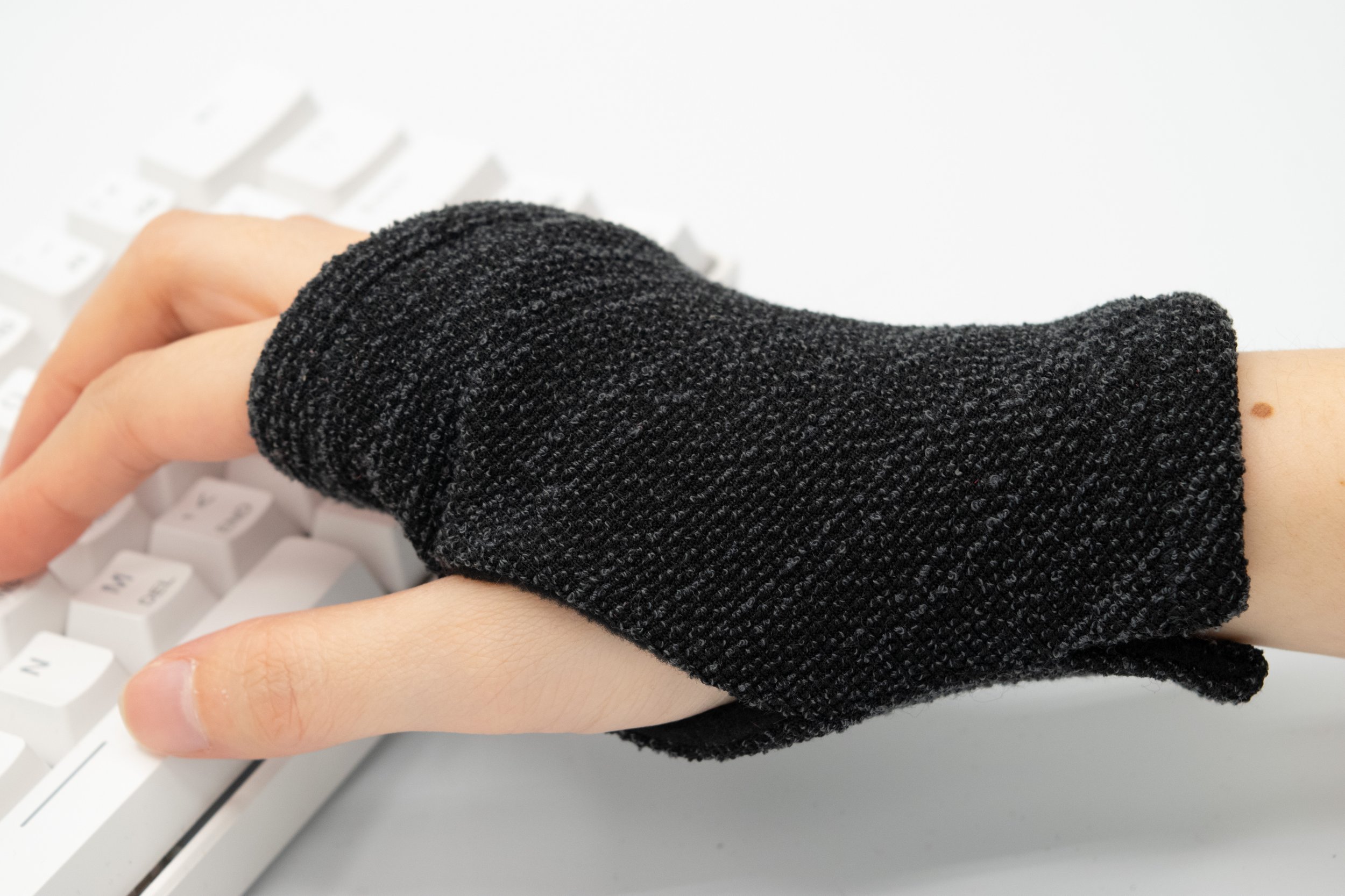 black-gray-textured-wrist-warmer-computer-glove