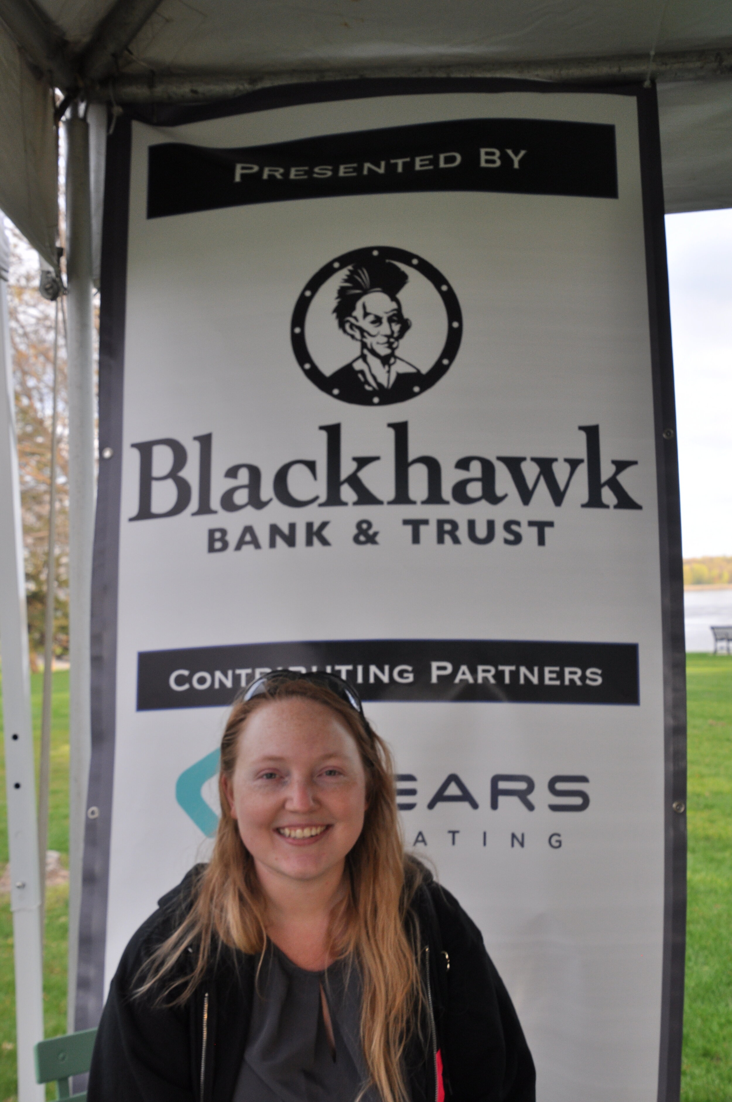 Blackhawk employee & banner.jpeg