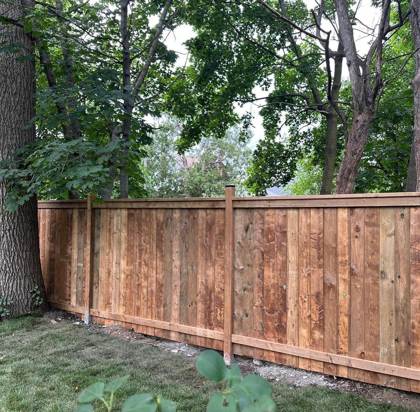 PT wood fence with 4x4 posts, side by side boards style