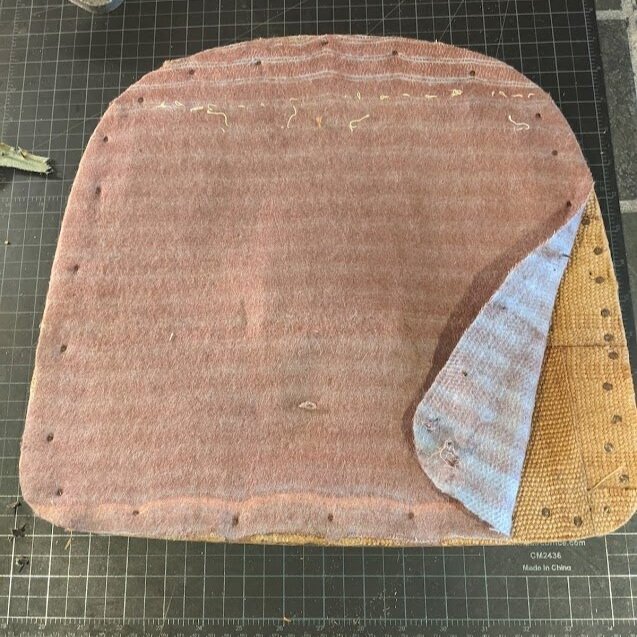 Not much was left of the original upholstery fabric and layers of old padding were ready to go!