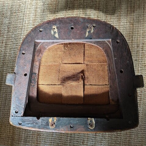 The swivel base was removed to begin the reupholstery