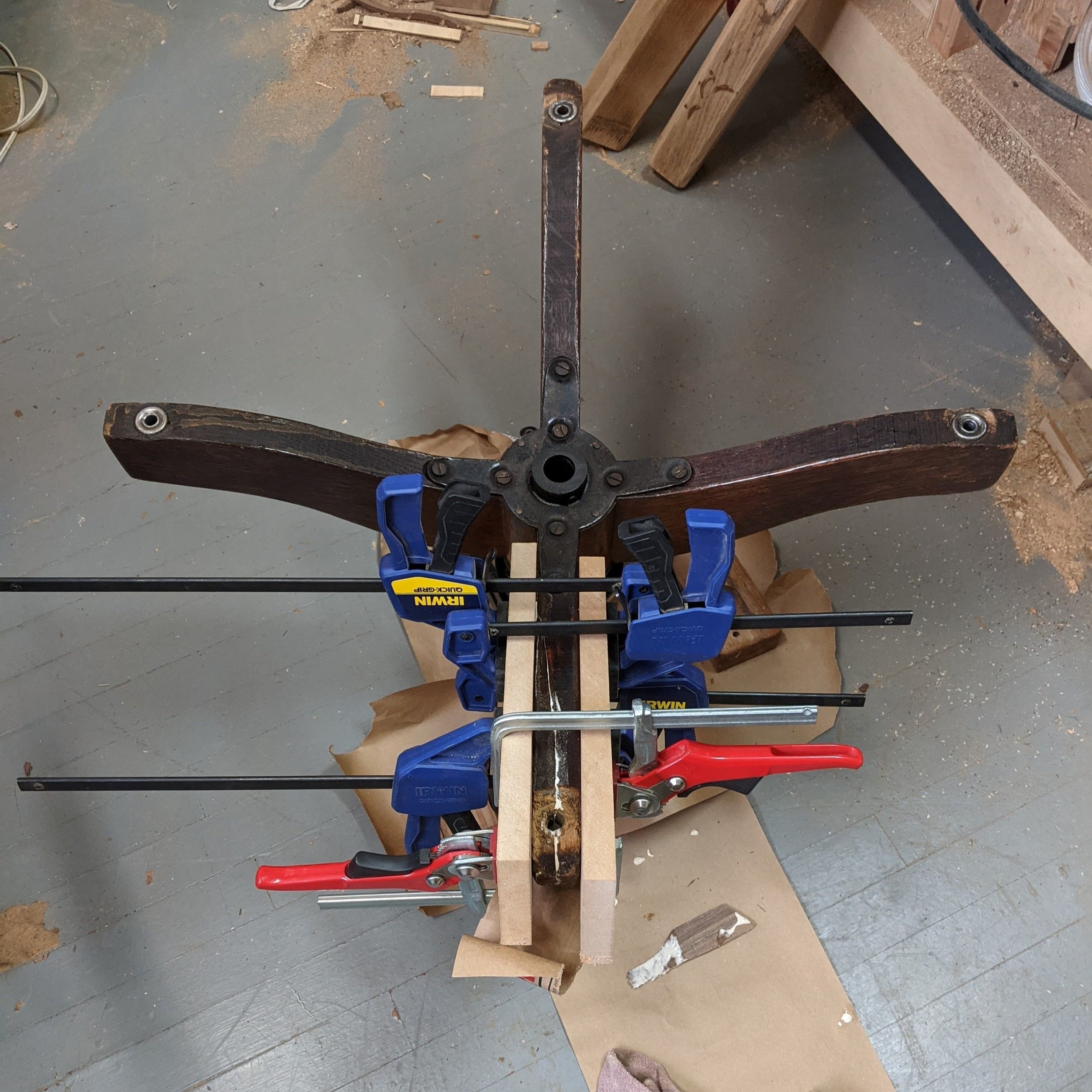 One leg had a split directly down the middle and was missing its socket caster. A glue up, wood filler, and staining was need for the repair