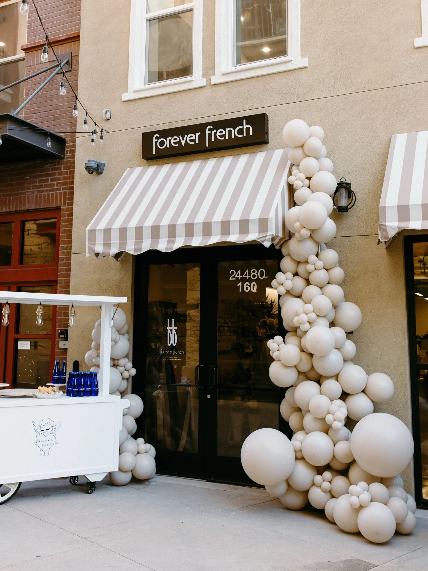 cutest store grand opening! congrats @foreverfrenchbaby , welcome to SCV! 🤍

Balloons, Lux Cart, Tote Wall &amp; Flower Display Stand: @inthedetails.co 
Photography: @salgado.photo
