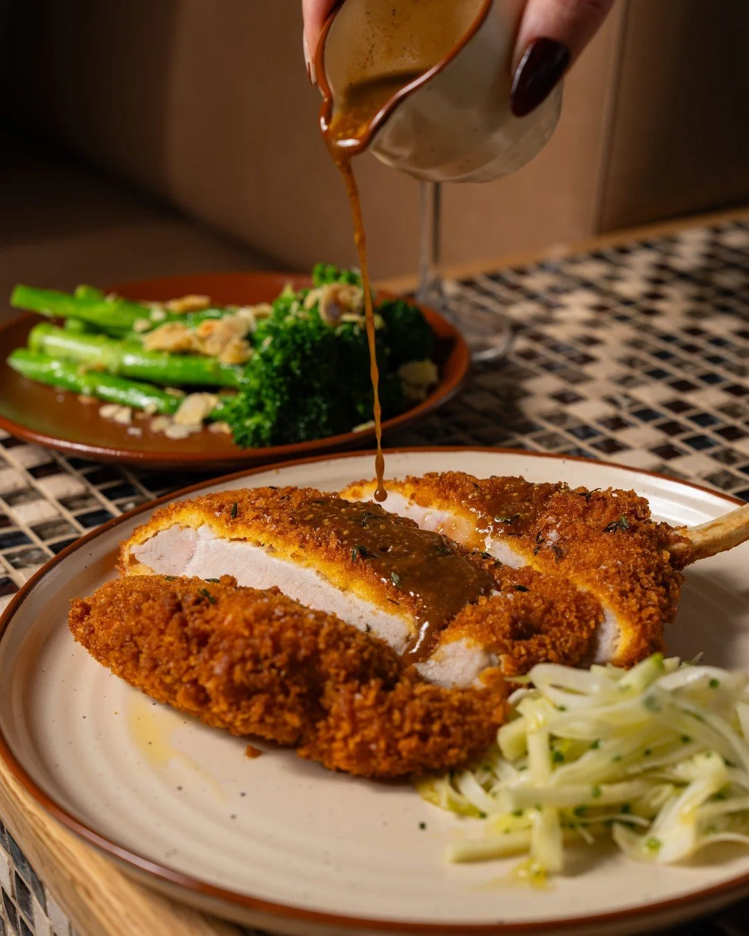 Golden Pork Cotoletta with fennel &amp; apple slaw and mustard sauce. Crispy, fresh and full of flavour.

Reserve your table now via the link in bio.

#mordeo