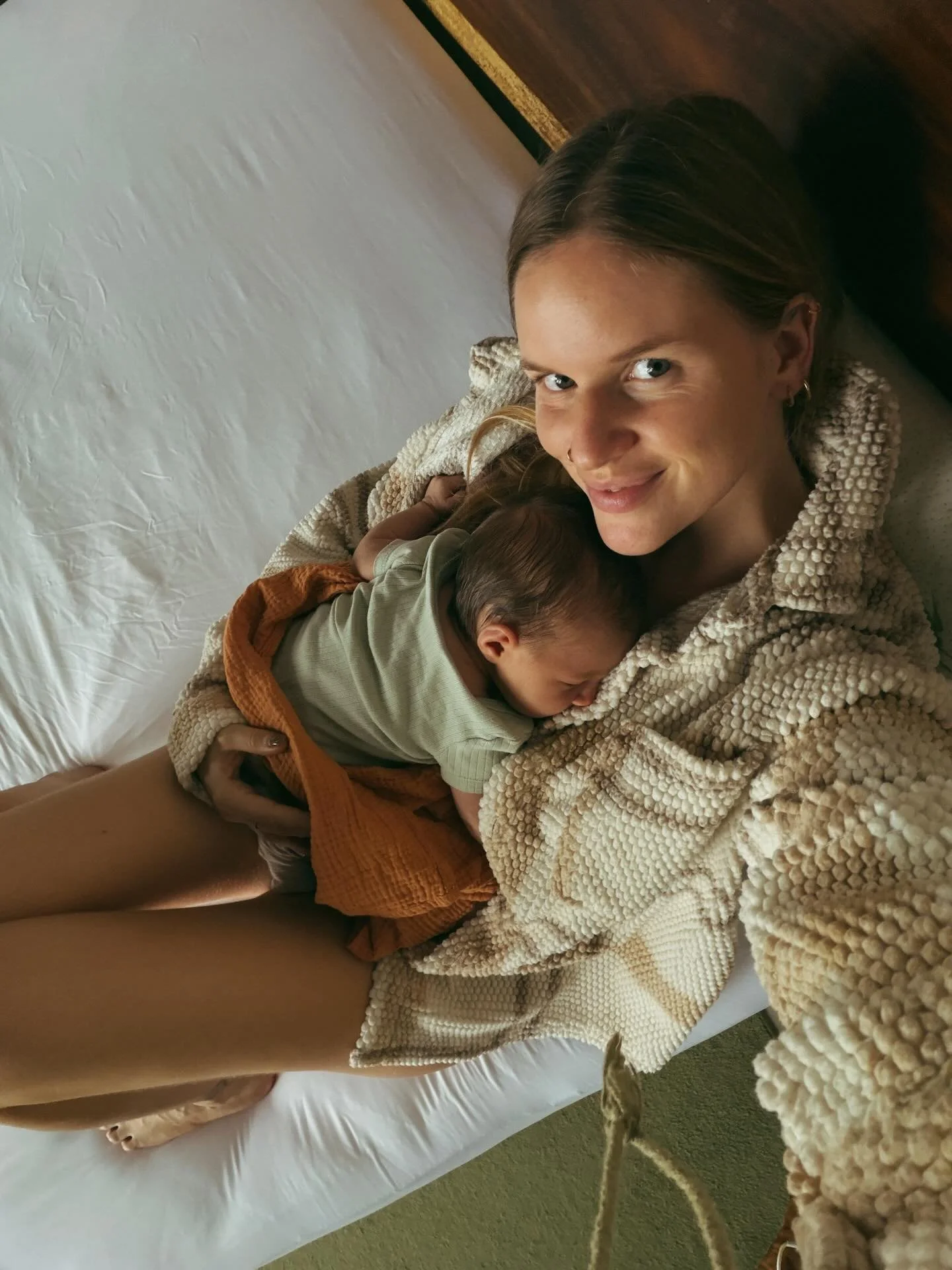 It was the first time we had a dinner out since birth. We sat at the table as the sunset rain poured onto the roof of the restaurant. Christmas lights flickering all around.

I was rocking Ayla as she slept.
Luke sat across from me and my mom to my l