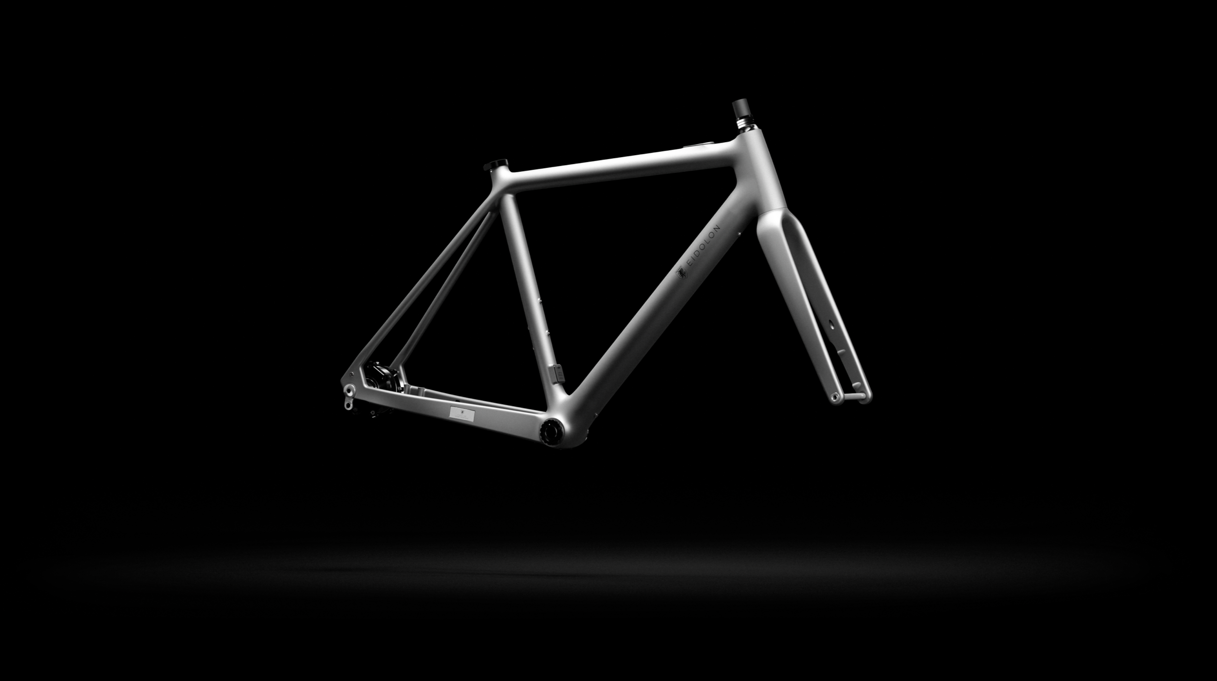 Ponomarets EIDOLON eBike Frameset in Platinum Grey against a black background.