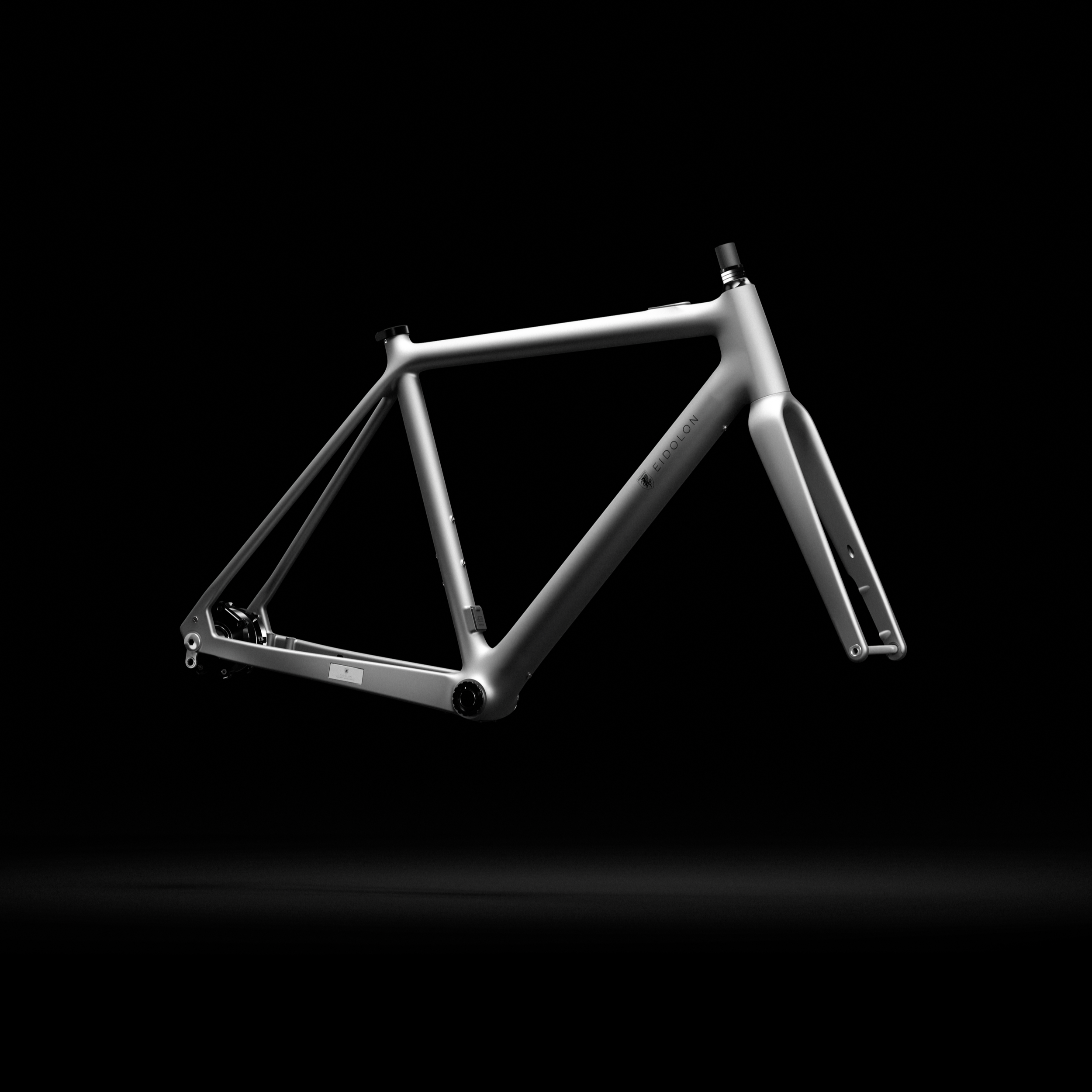 Ponomarets EIDOLON eBike Frameset in Platinum Grey against a black background.