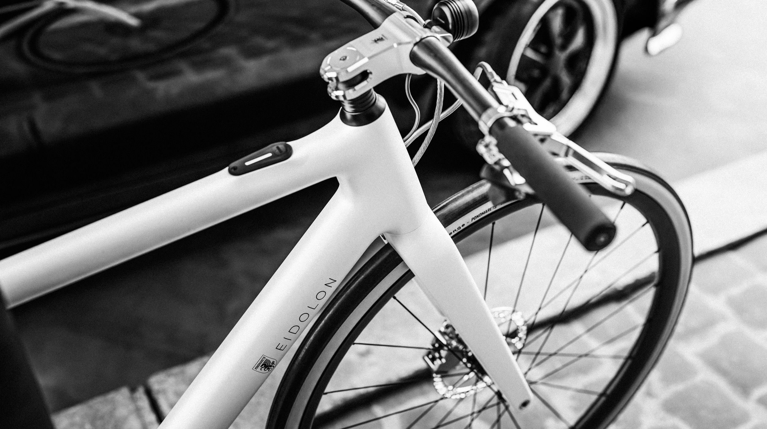 Black and white close-up of Ponomarets EIDOLON eBike top tube and cockpit.