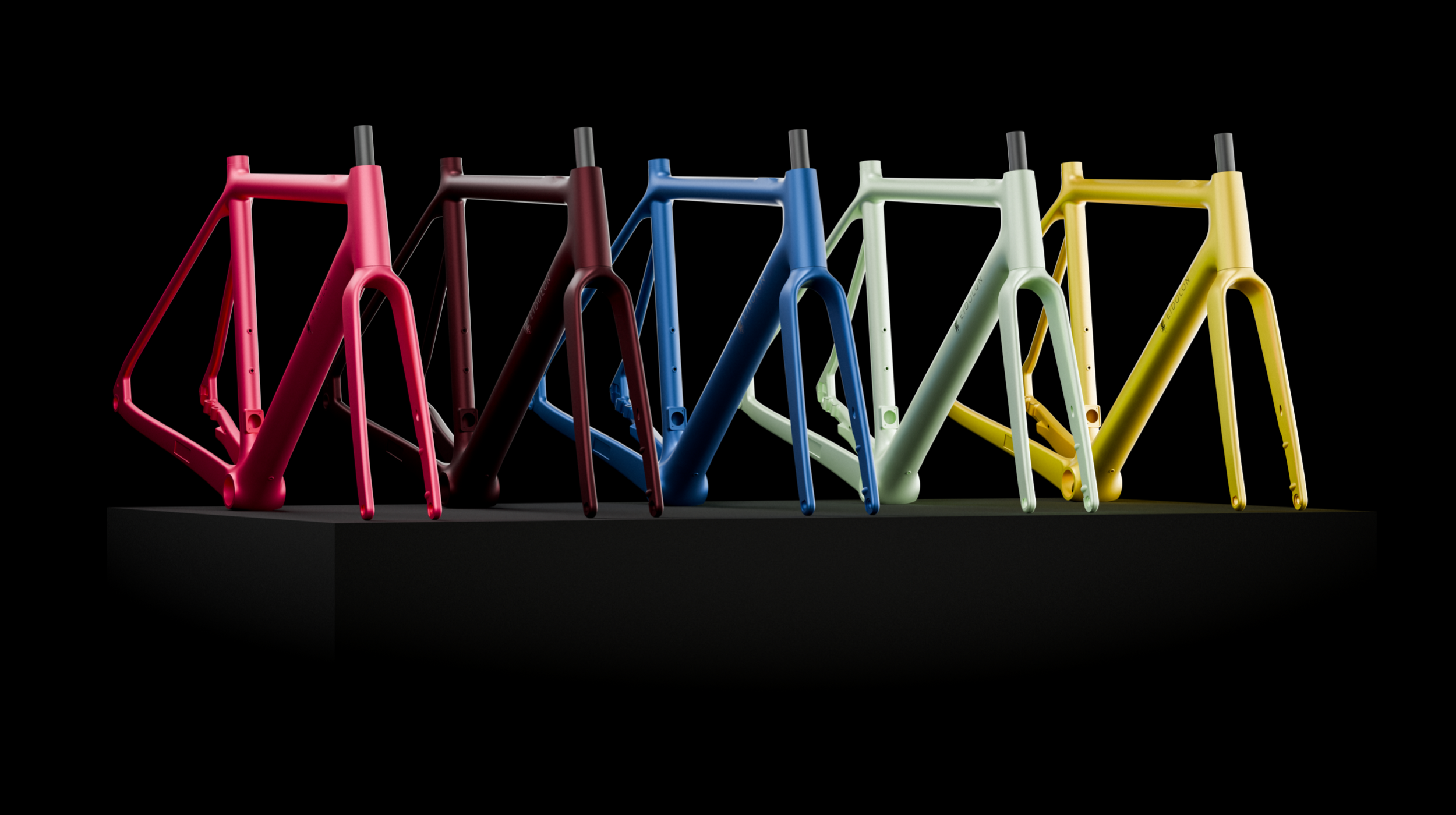 Six Ponomarets EIDOLON frames in different colour finishes arranged on a black plinth against a black background.