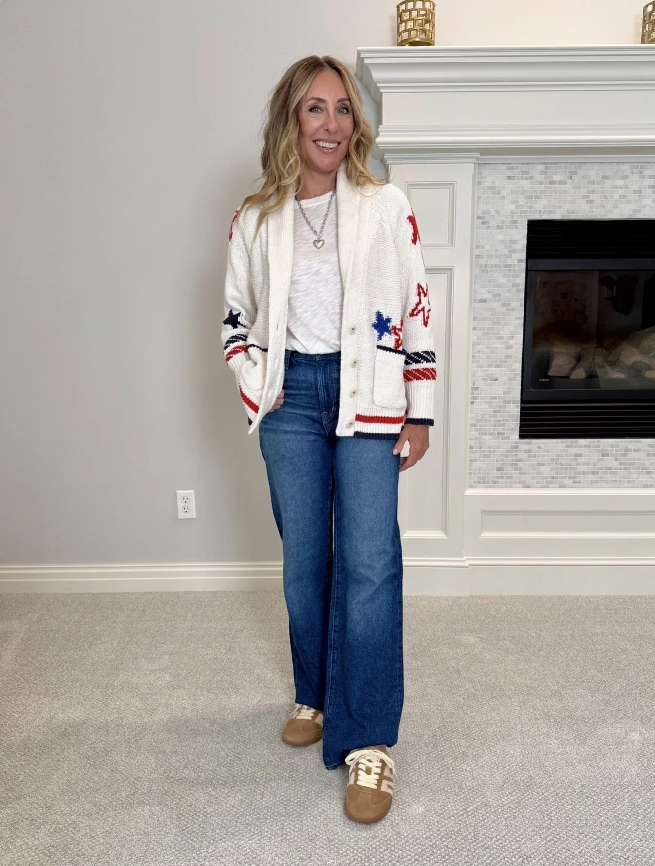 Hallie in the Anthropologie red white and blue star print cardigan, a look for less for THE GREAT, with jeans and sneakers