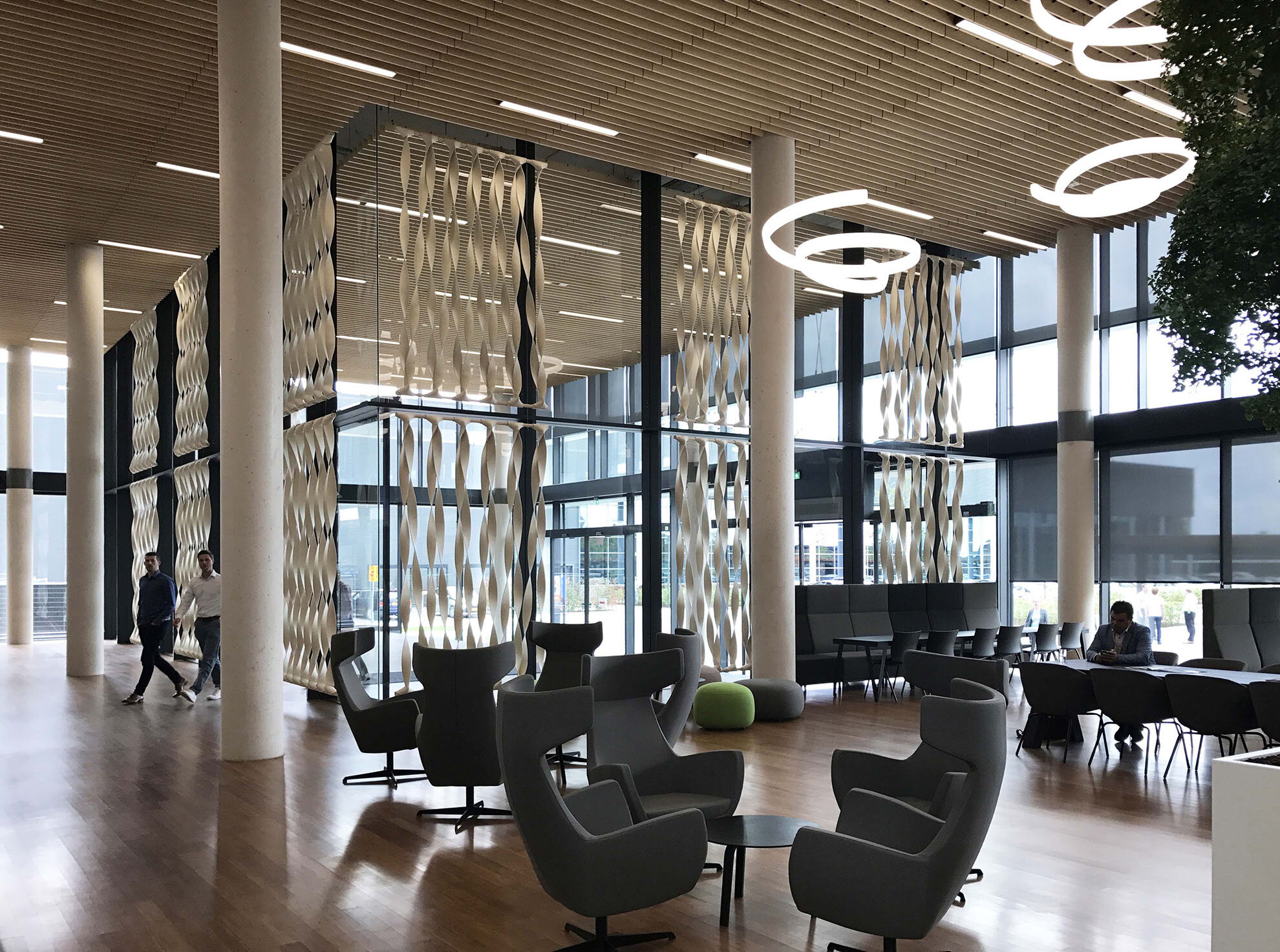 Glass walls are beautiful but can be an acoustic nightmare, this wool felt design can help