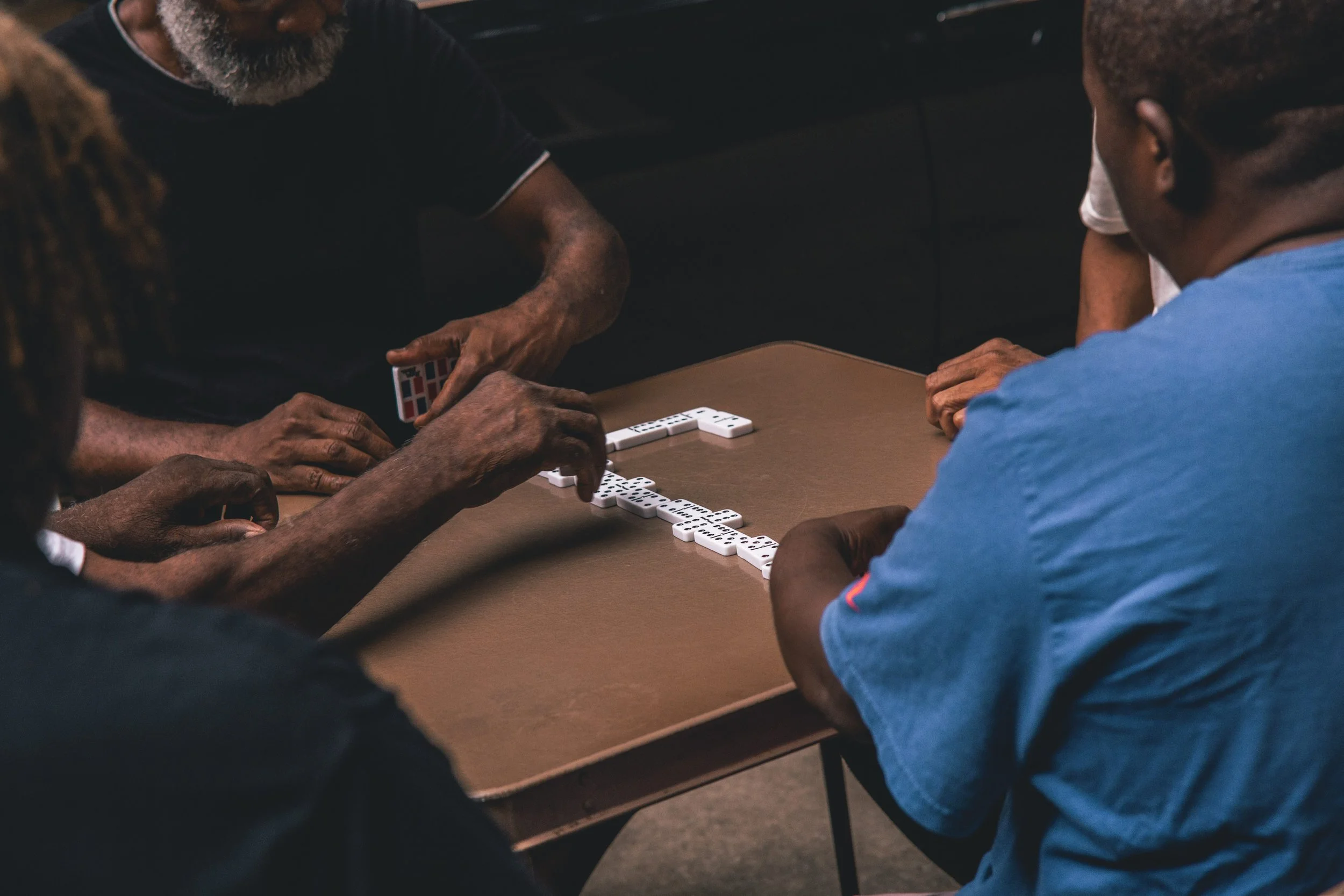group of men playing dominos
