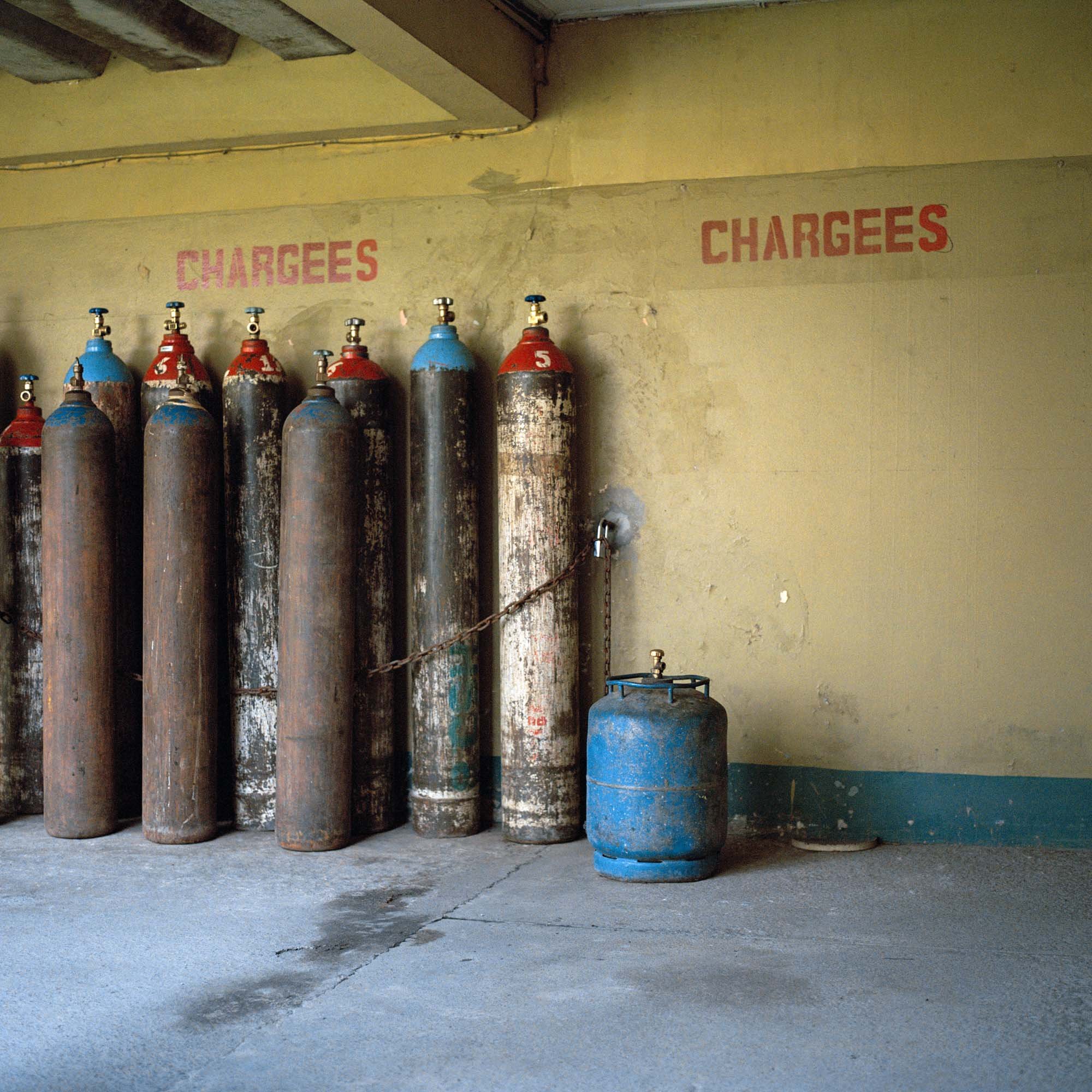 In the open corridors of the Saint Joseph clinic in Kinshasa, the gas cylinders that keep the hospital running.