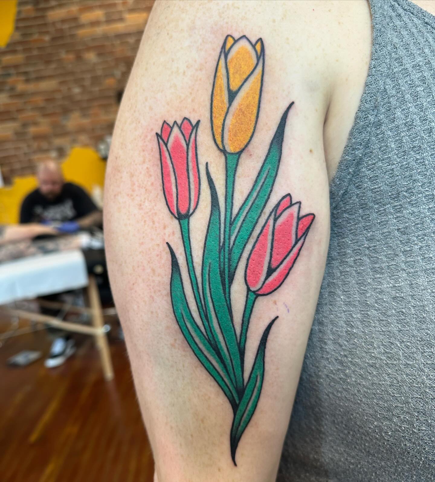 Tulips by @jerika.tattoos 🌷 we are open Wednesday-Saturday 12-7pm, walk-ins welcome. 
.
.
.
#springfieldmo #417 #commercialstreet #historiccstreet #cstreet