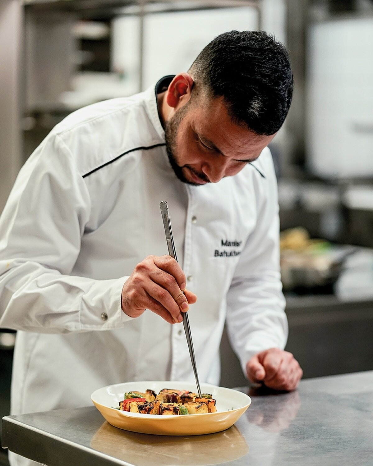 Deep in focus, precision in every move. Executive chef Manish making sure every element of your dish is perfection in flavour and presentation. 
#indiaclubberlin