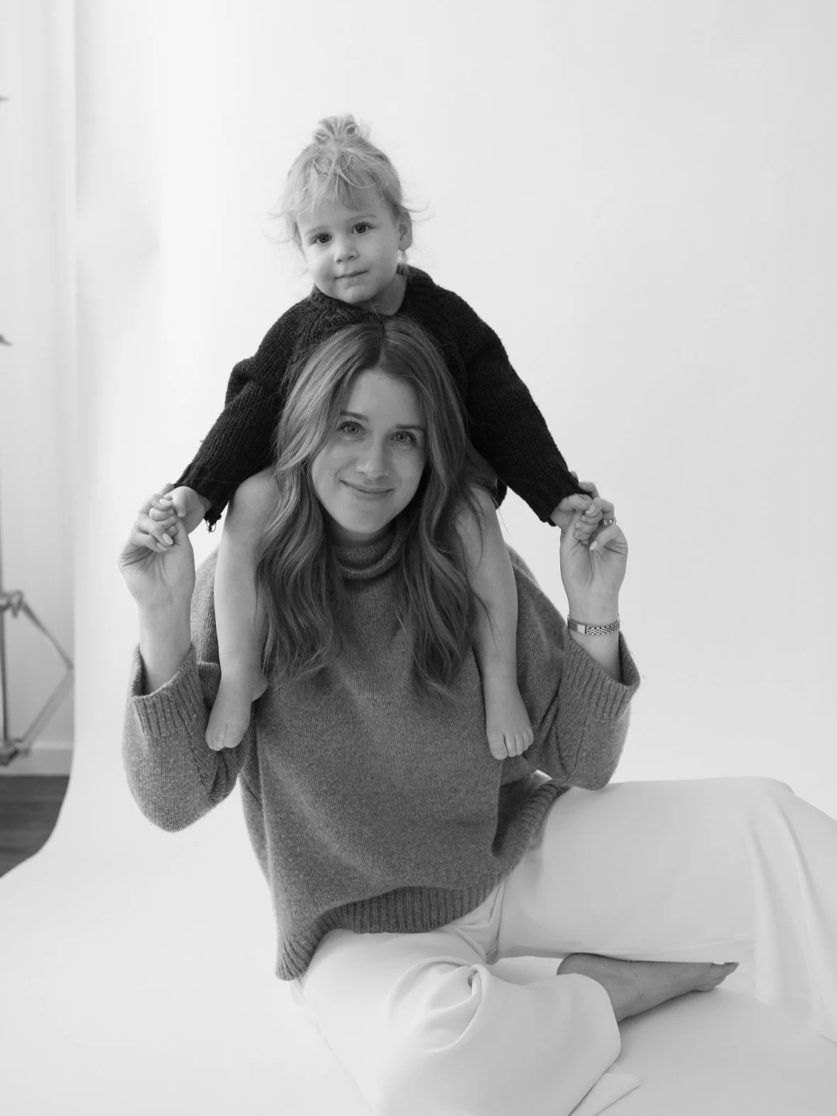 I love the way all noise is taken out of an image when you&rsquo;re shooting in the studio. Subtraction of elements brings closeness and intimate images that are harder to achieve outdoors. Nowhere to run or play so they find climbing on mom to be mo