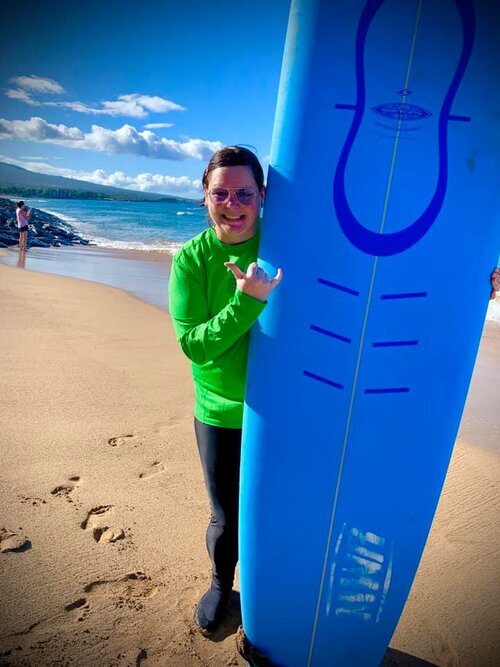 Jersey posing with a surfboard.
