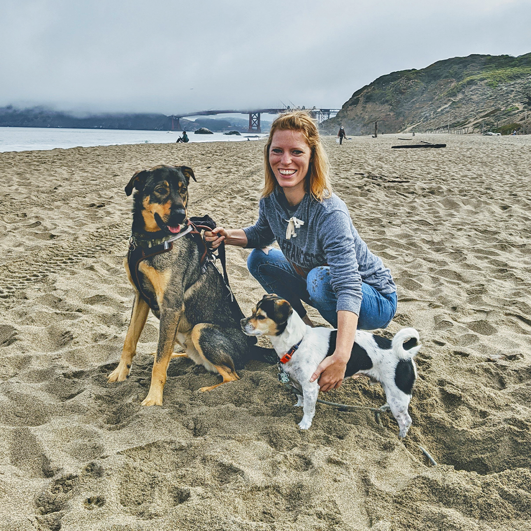 Koa with her dogs on the beach.