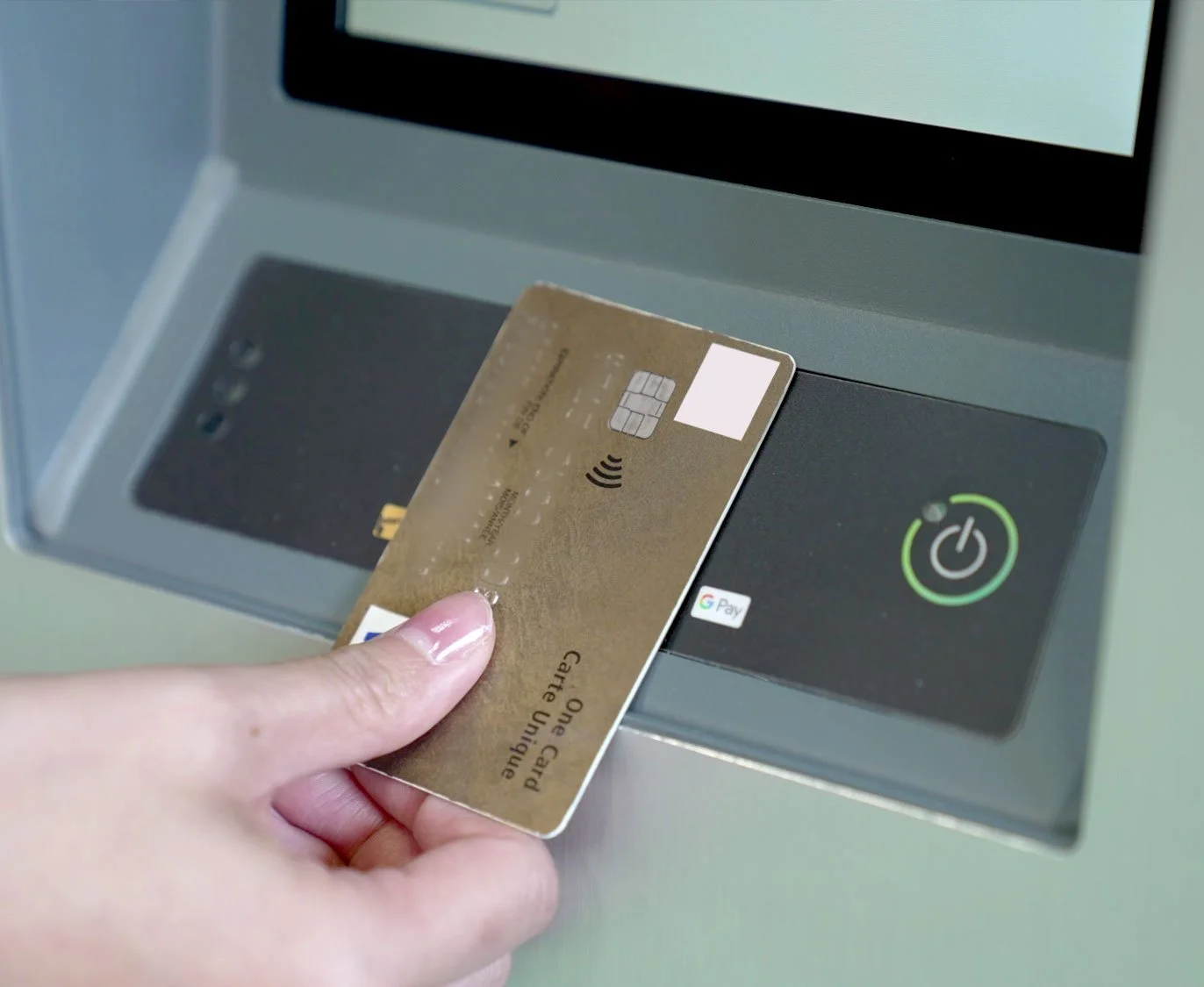 Driver tapping a credit card to pay at a parking meter