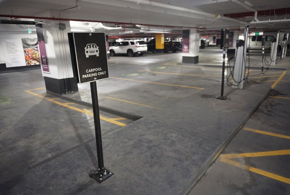 Underground parking facility, sign indicating that this parking stall is for Carpool parking only