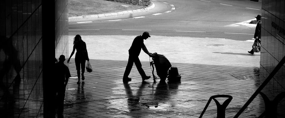 Perry's Reliable Cleaning team member pushing a cleaning cart