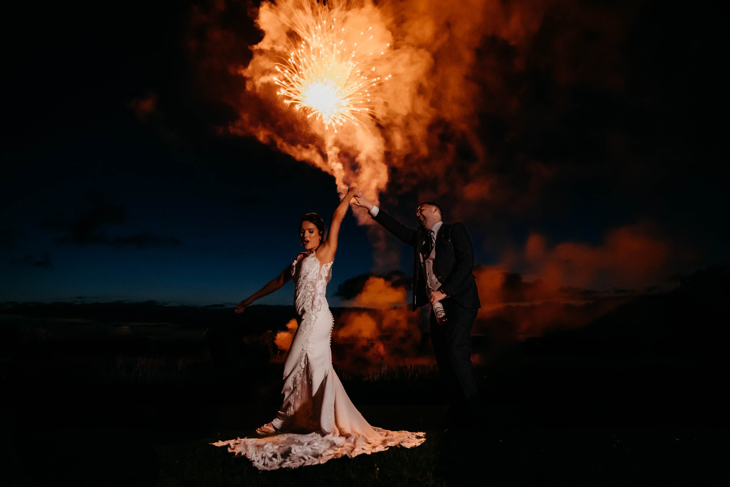 bride and groom with Fireworks at Quantock Lakes wedding venue somerset