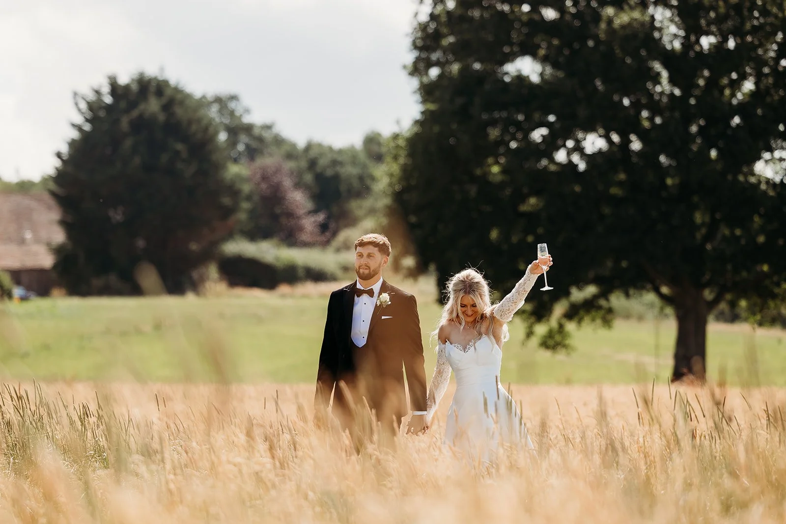 bride and groom in field at Quantock Lakes