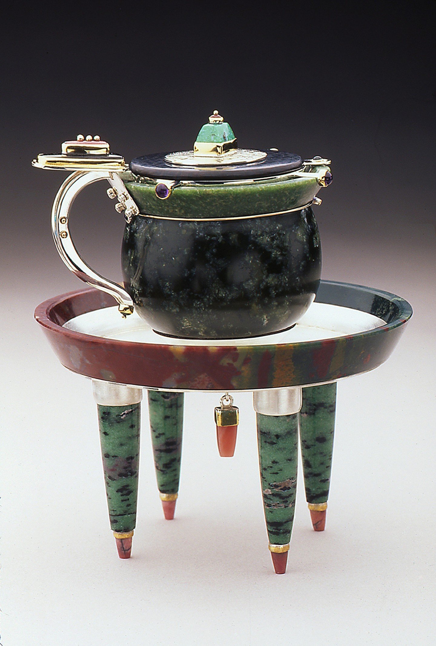 #throwbackthursday !
Tea Cup Circa 1999: Collection of the Museum of Art and Design NY:
22k, 18k, Sterling Silver, Ruby, Gem Silica, Fossil Palm Wood, Bustamite, Black Jade, Emerald, Amethyst, Jasper, Zoisite, Rhodochrosite, Jade
*
*
*
*
*
#michaelbo
