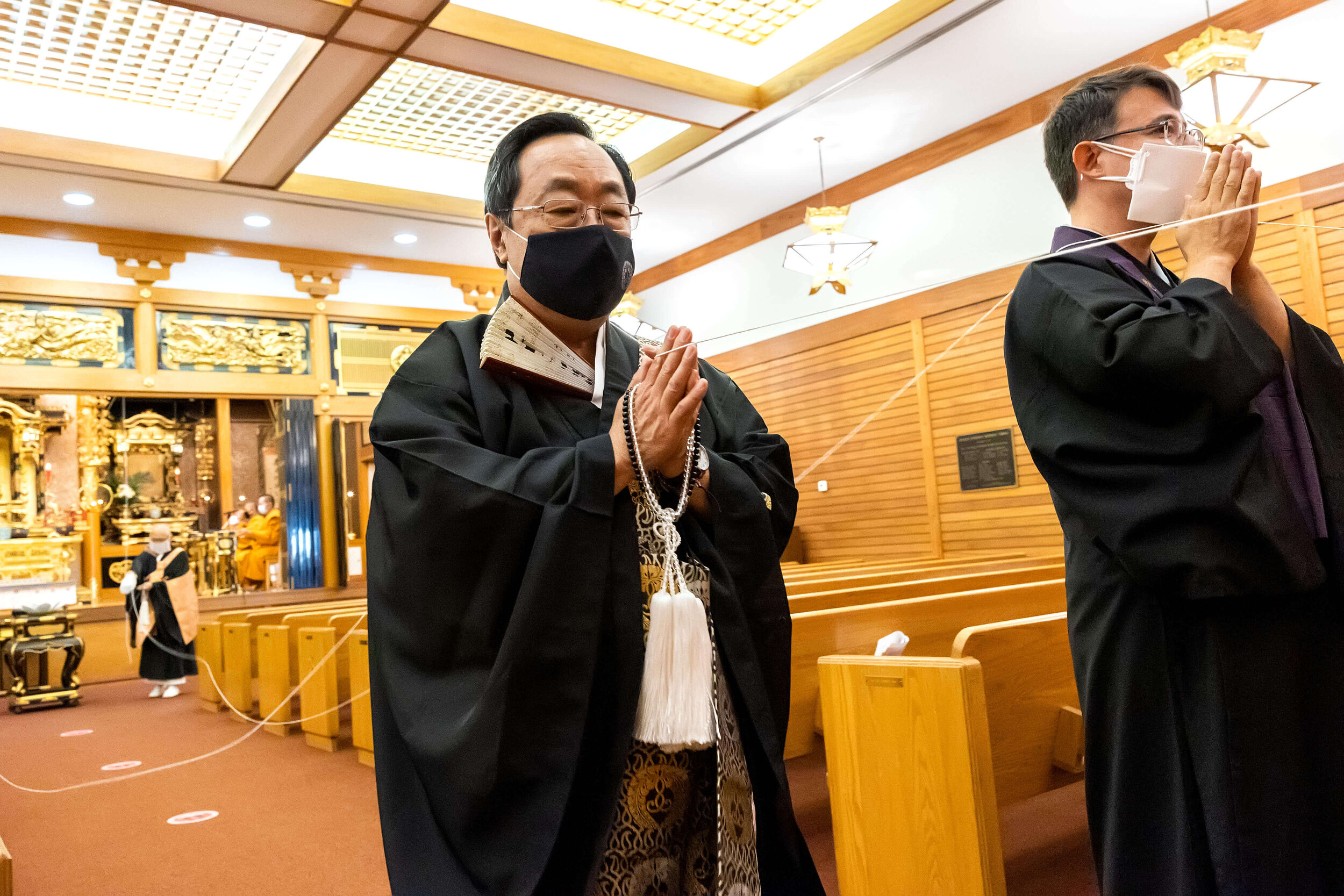 Rev. Duncan Ryuken Williams and Bishop Marvin Harada process out of the main hall