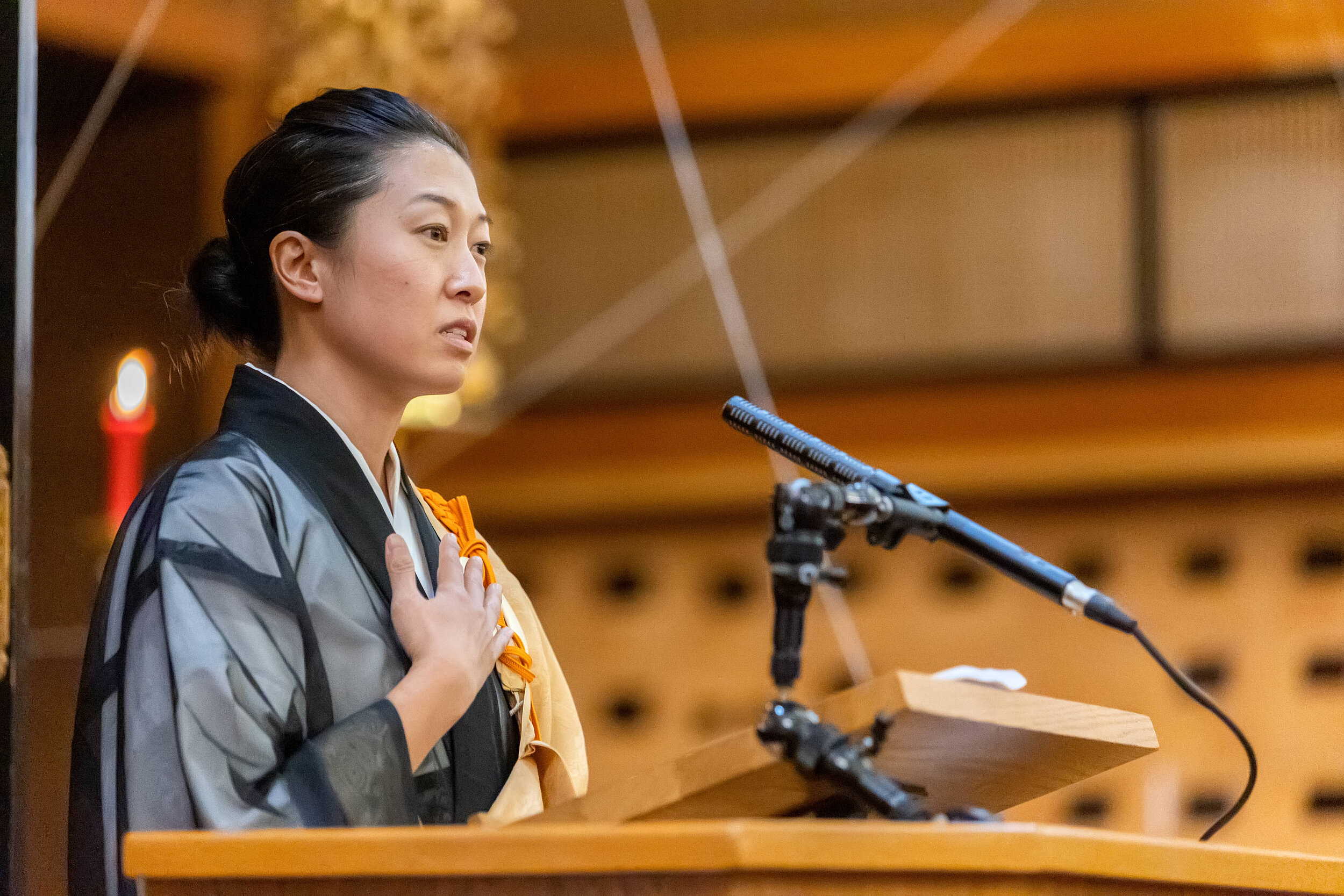 Rev. Cristina Moon delivering a Dharma message on virya paramita