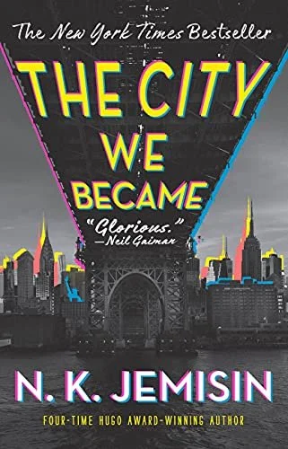 Book cover of 'The City We Became' by N.K. Jemisin featuring a stylized city skyline and neon title lettering.