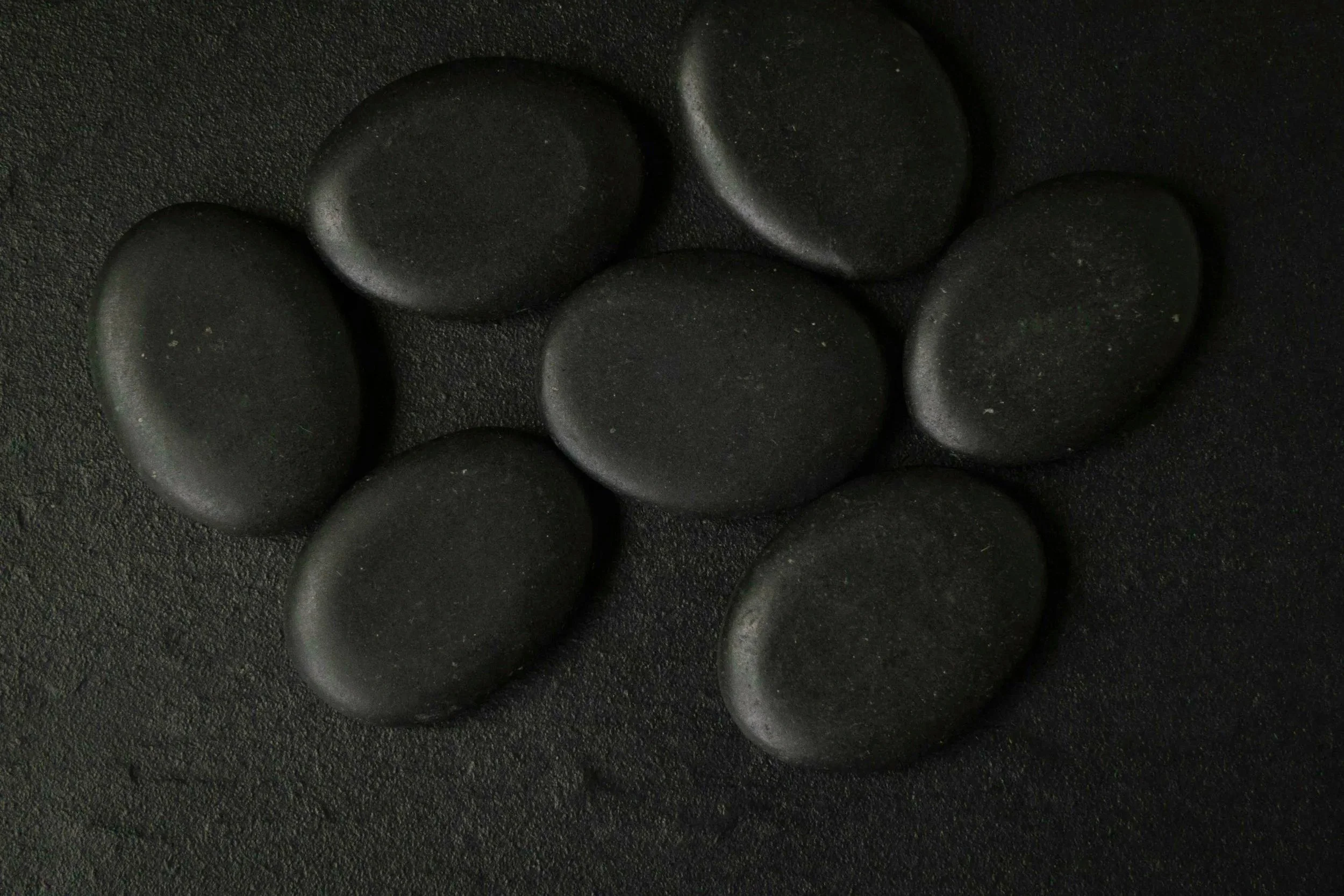 Smooth, heated hot stones for relaxing massage in Bar Harbor, Maine