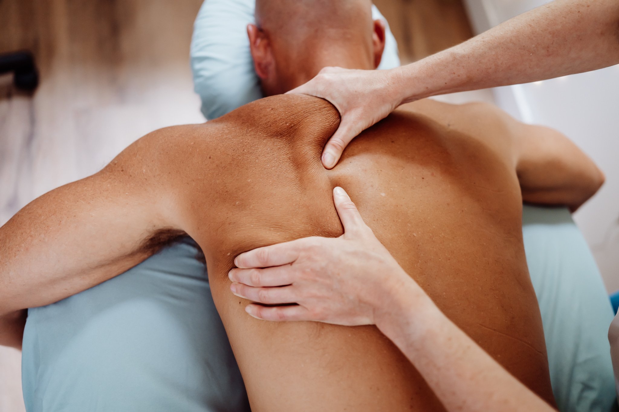 Deep tissue and sports massage techniques focused on shoulder and rotator cuff injuries