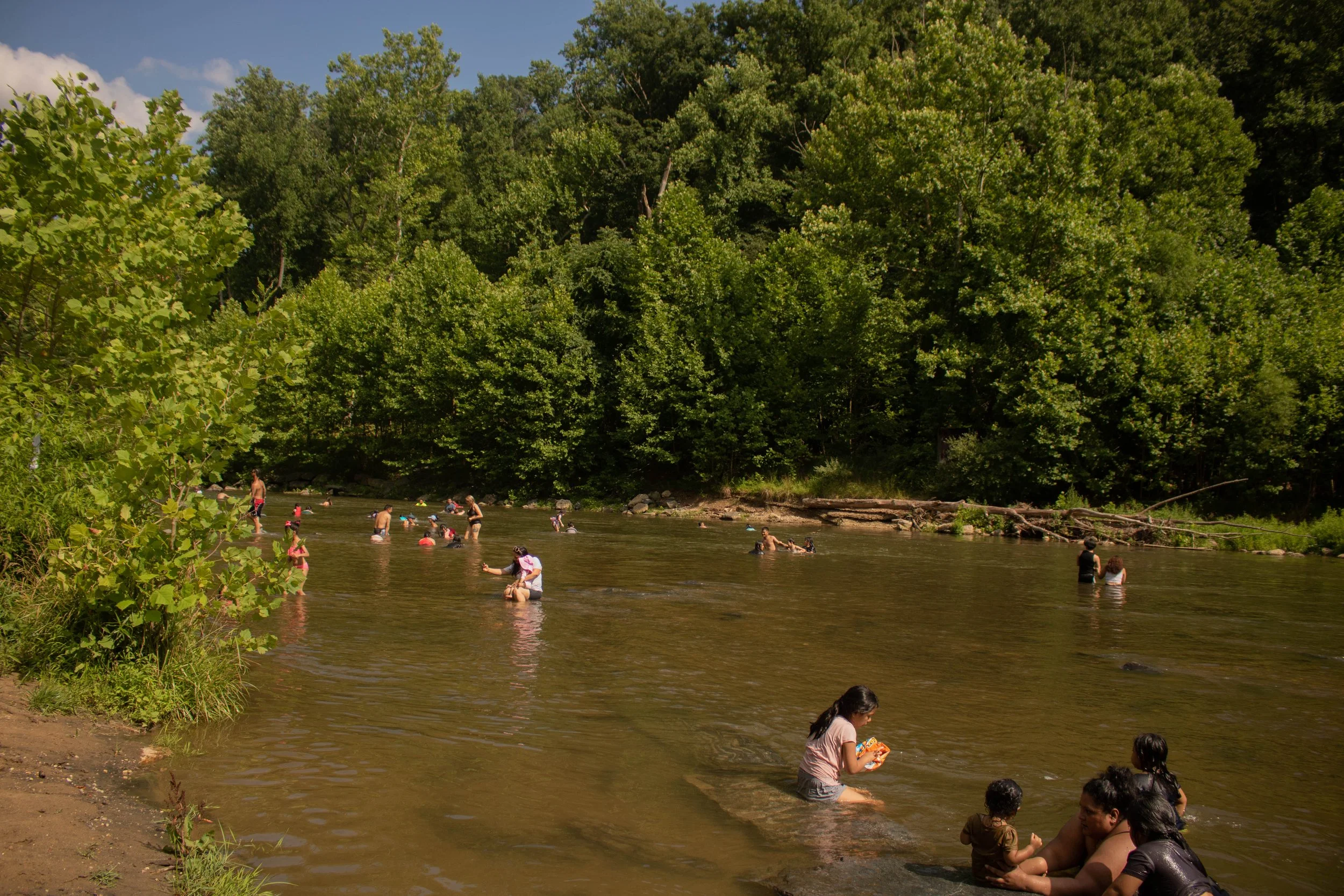 Families cool off on a hot summer day at Patapsco Valley State Park in Ellicott City, MD in June 2024.