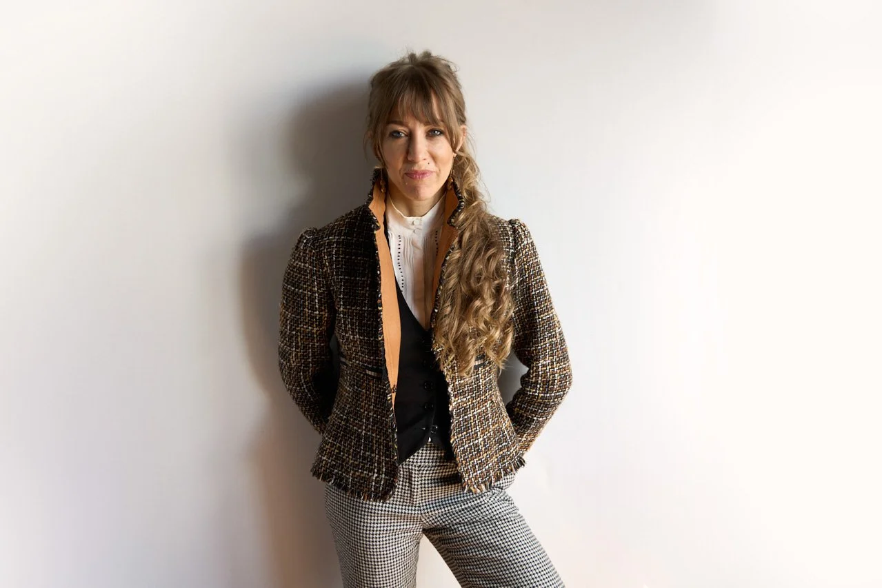 Nik Vogler Standing against a wall