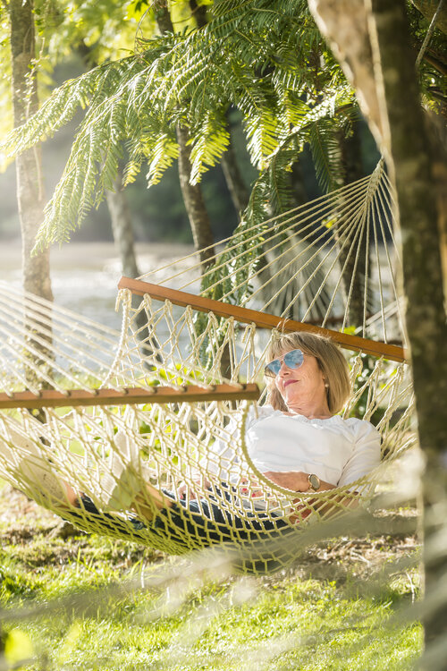 Relaxing in a Hammock at Furneaux Lodge