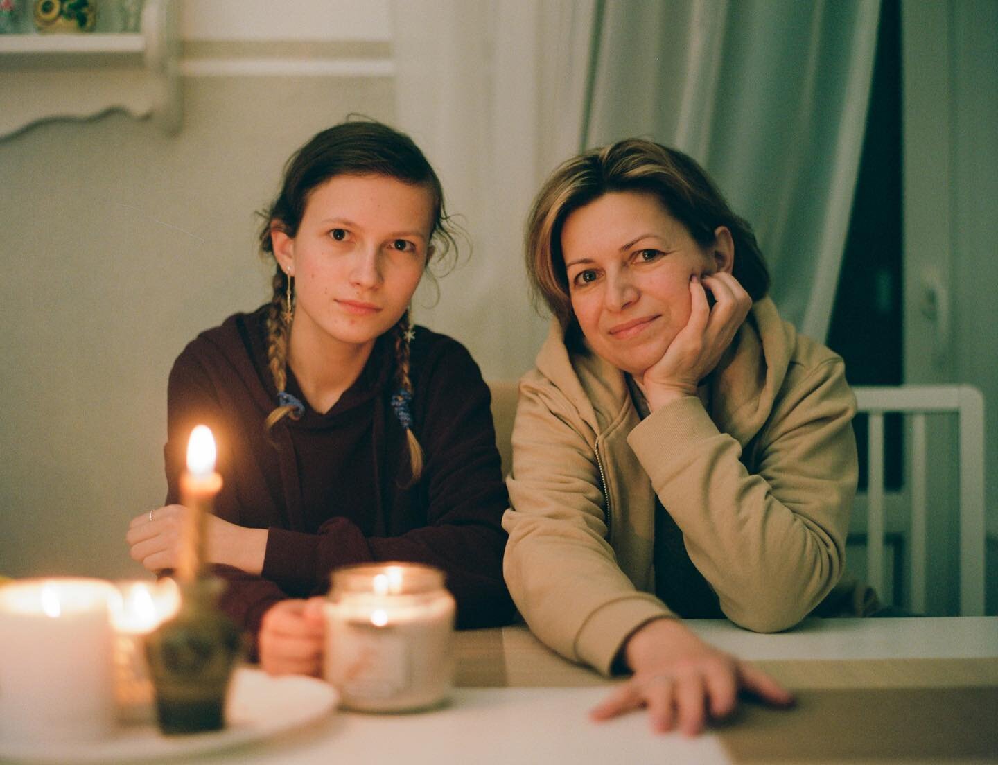 My mom and my sister during the energy cut in Lviv, Ukraine. 
In almost a year of full-on r**sіаn invаsіоn of Ukraine the rubbing sound of generators on the streets became ever so present. My mom, a university professor, became a master of turning-th