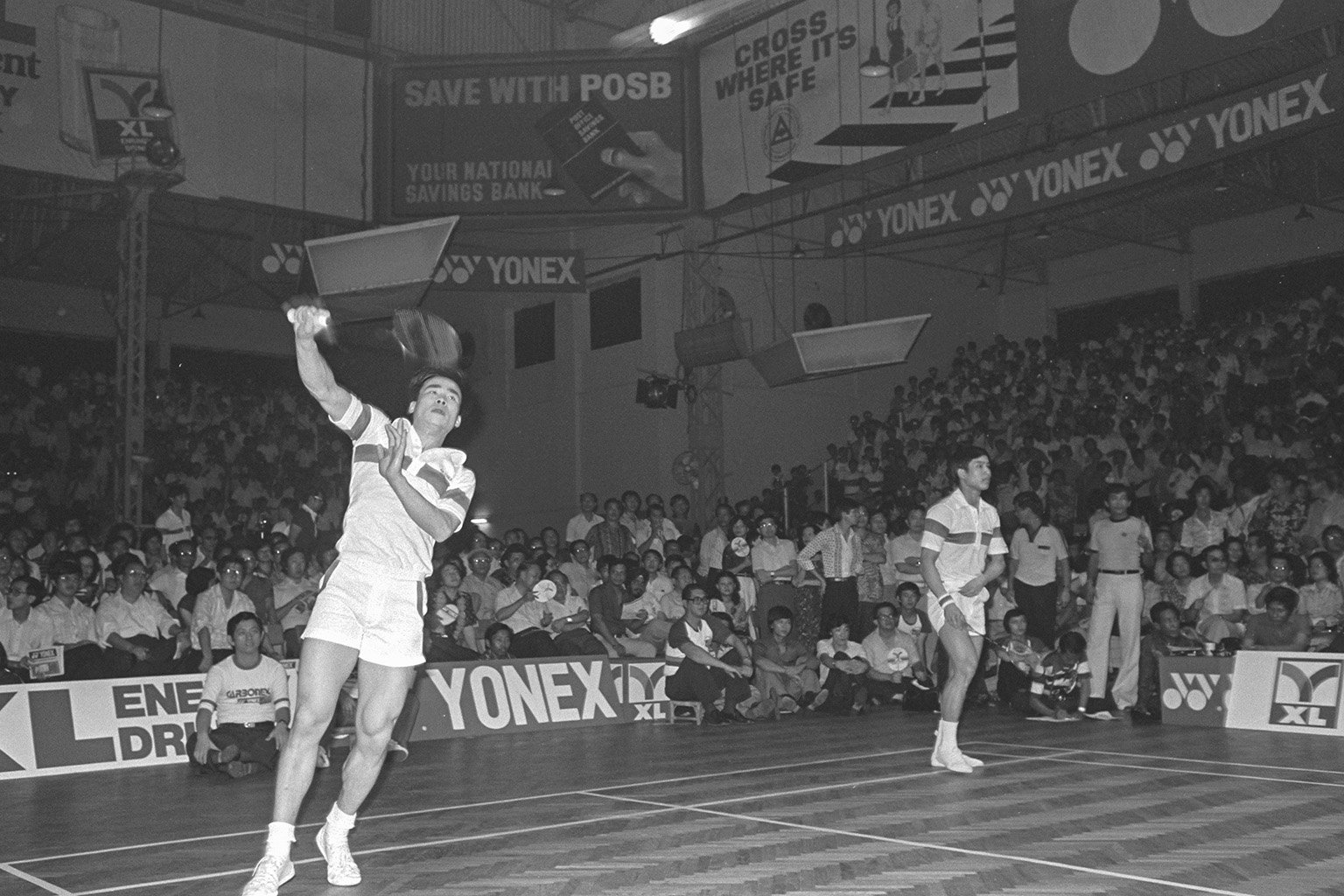 An interior view from 1980 showing a badminton match between China and Indonesia. 