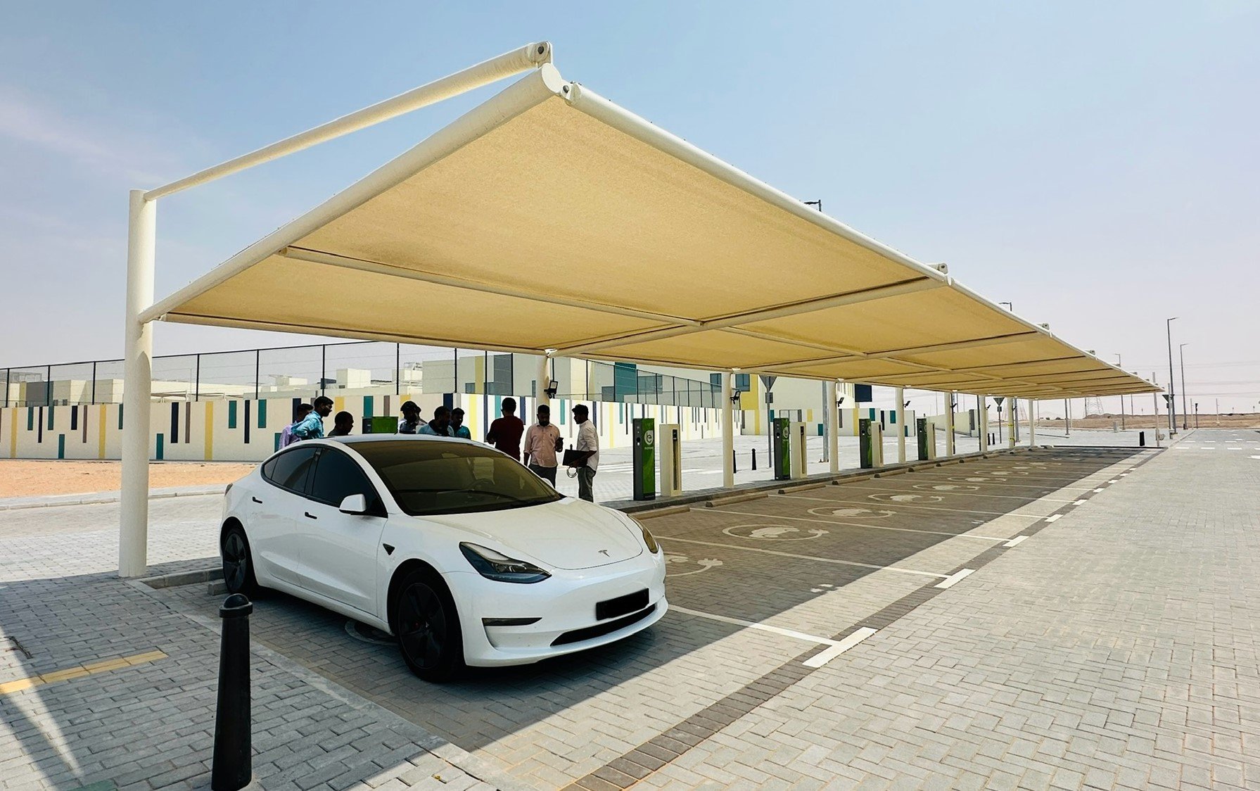 Stout Energy Supports Testing and Commissioning of 100 EV Chargers for ADEK School Projects