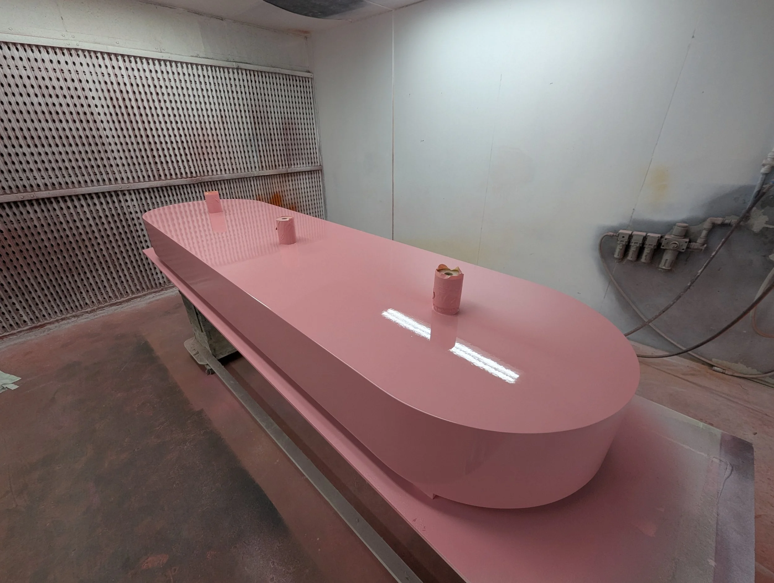 Spray finishing scenic components in Creator International's workshop
