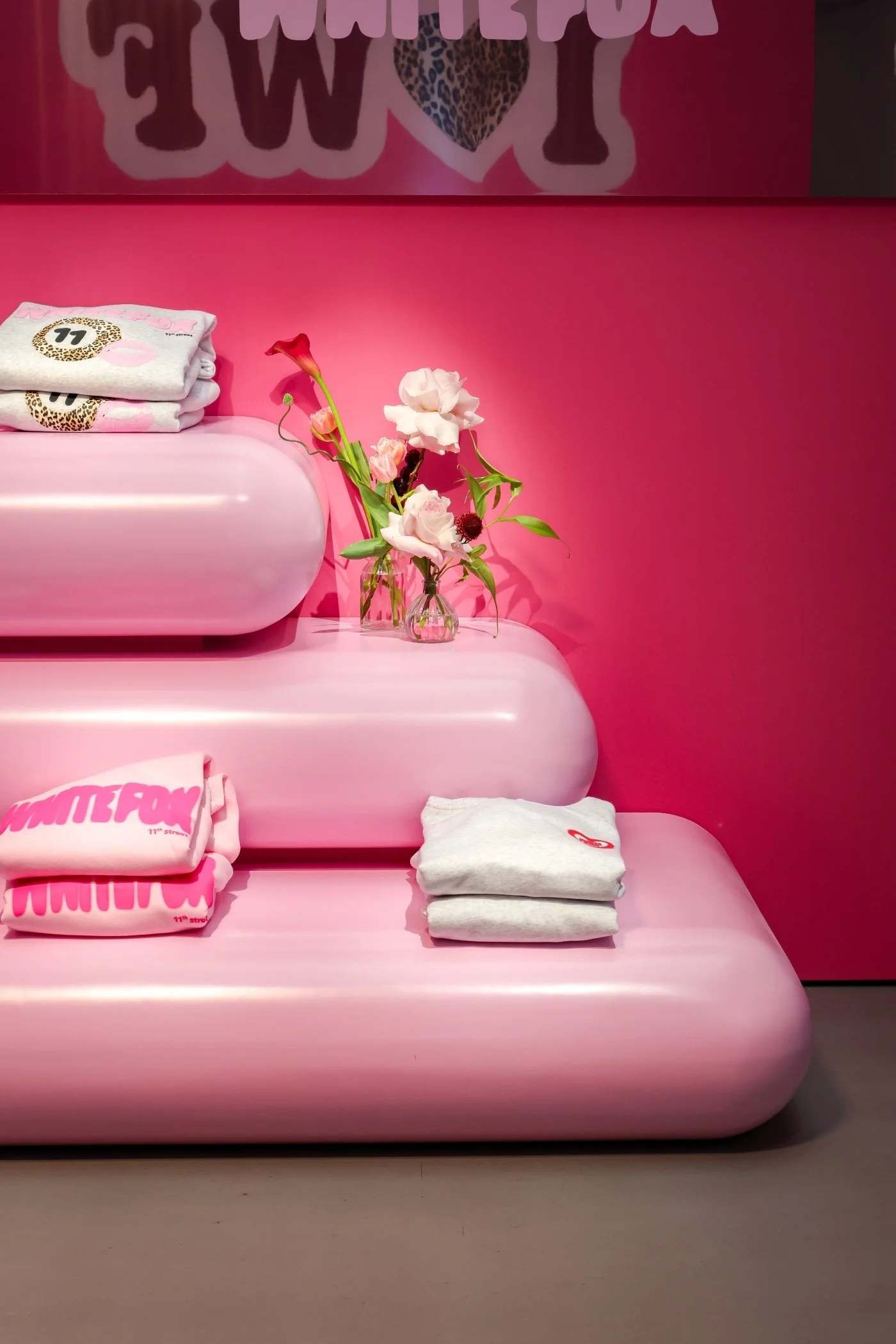 White Fox 11th Street gifting suite with curved pink shelves at Vinyl Factory London by Creator International for Heaps + Stacks